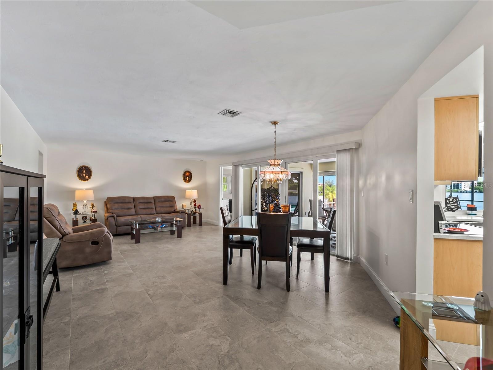 DiningLiving_2903rdStreet_BonitaSprings_OpenConcept_LanaiView.jpg