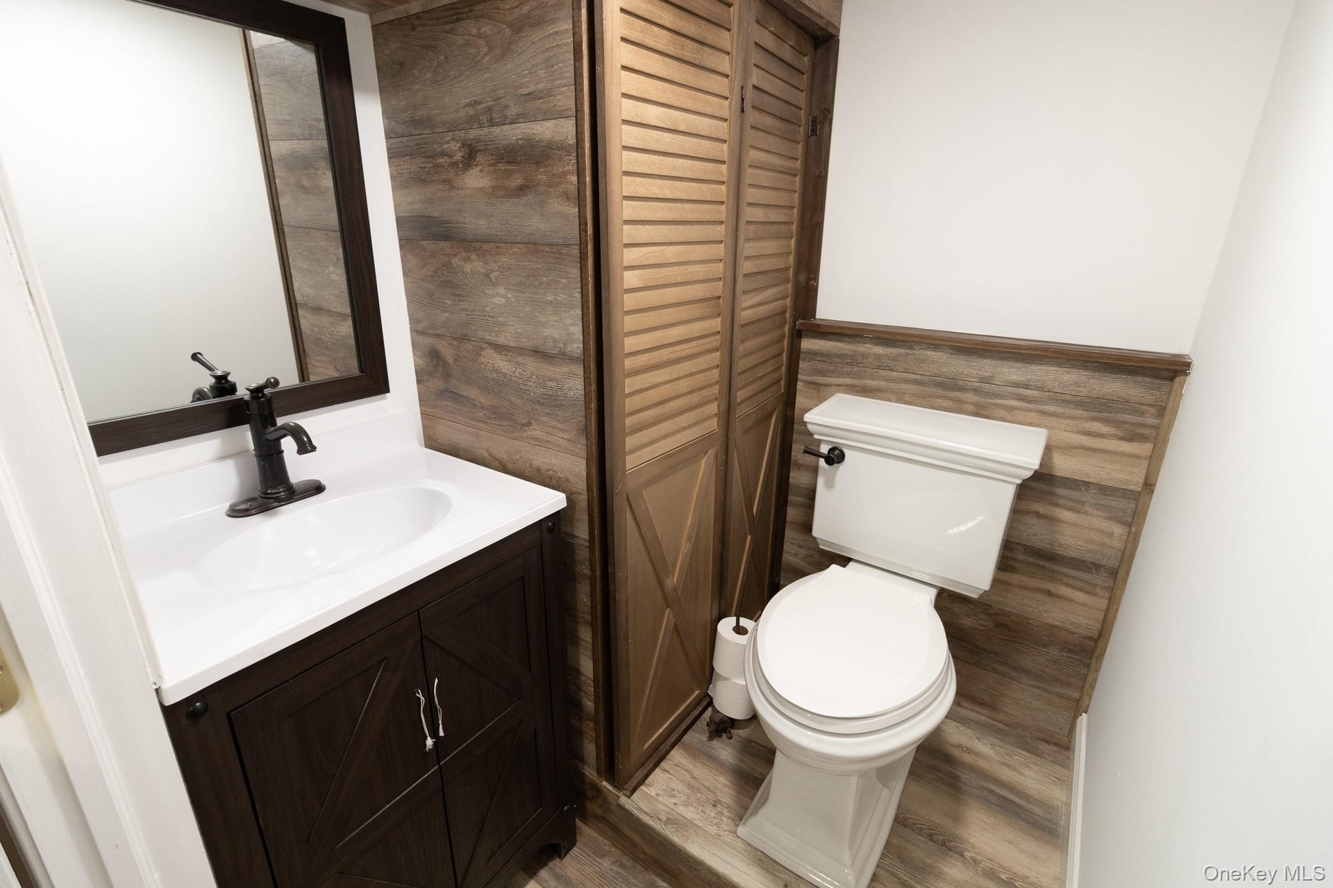 An additional bathroom featuring classic fixtures and finishes to compliment any style.