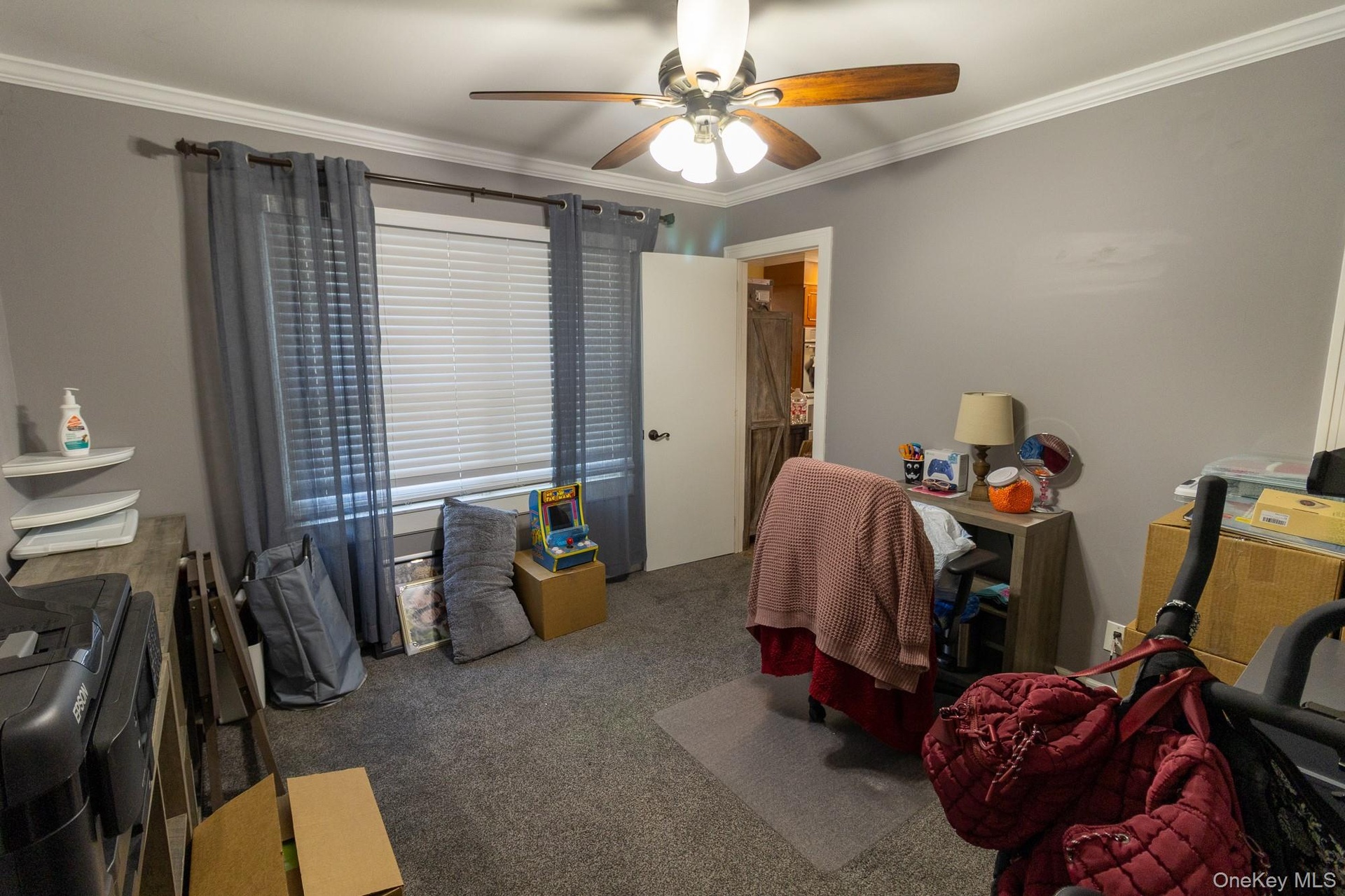 This flexible bedroom space offers multiple possible uses for a variety of house