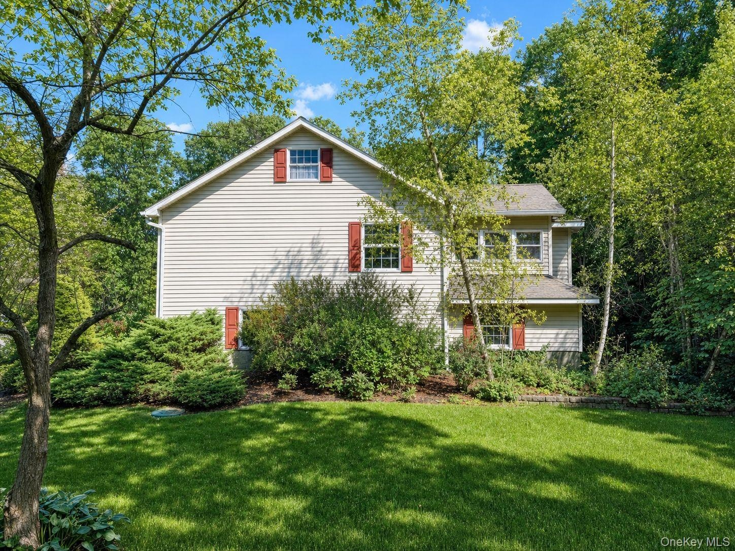 Manicured lawn and mature foliage
