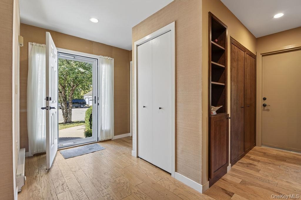 Powder room and large coat closet upon entry