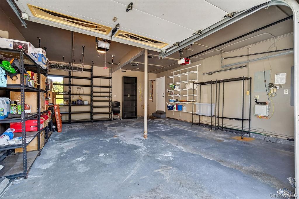 This garage comfortably fits 2 cars, even that big SUV, and you still have plenty of space for storage