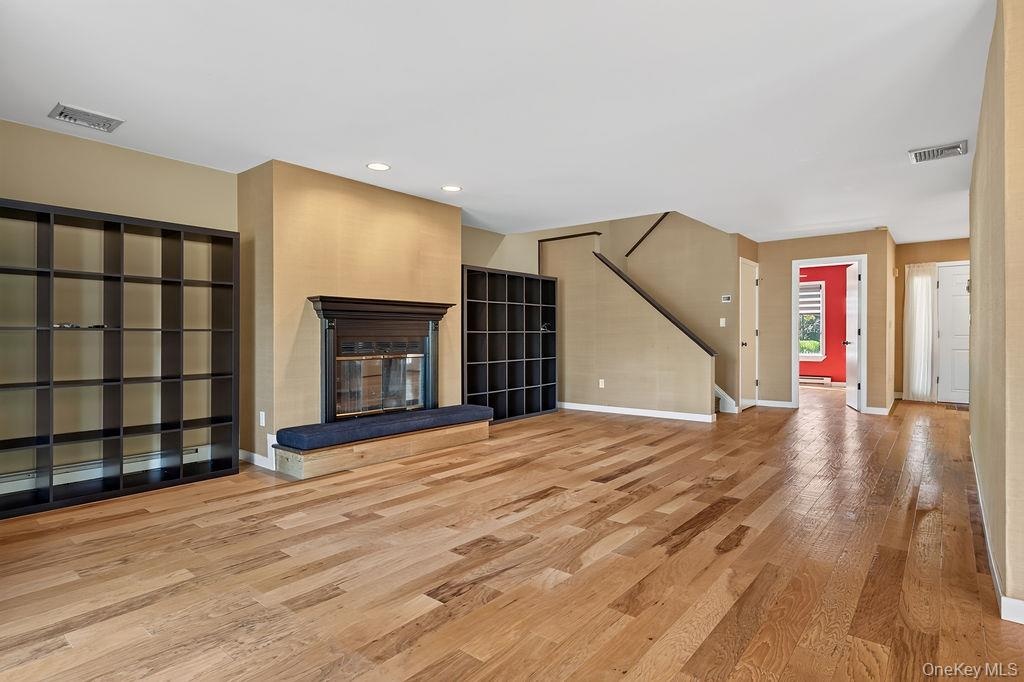 Expansive living room with wood burning fireplace