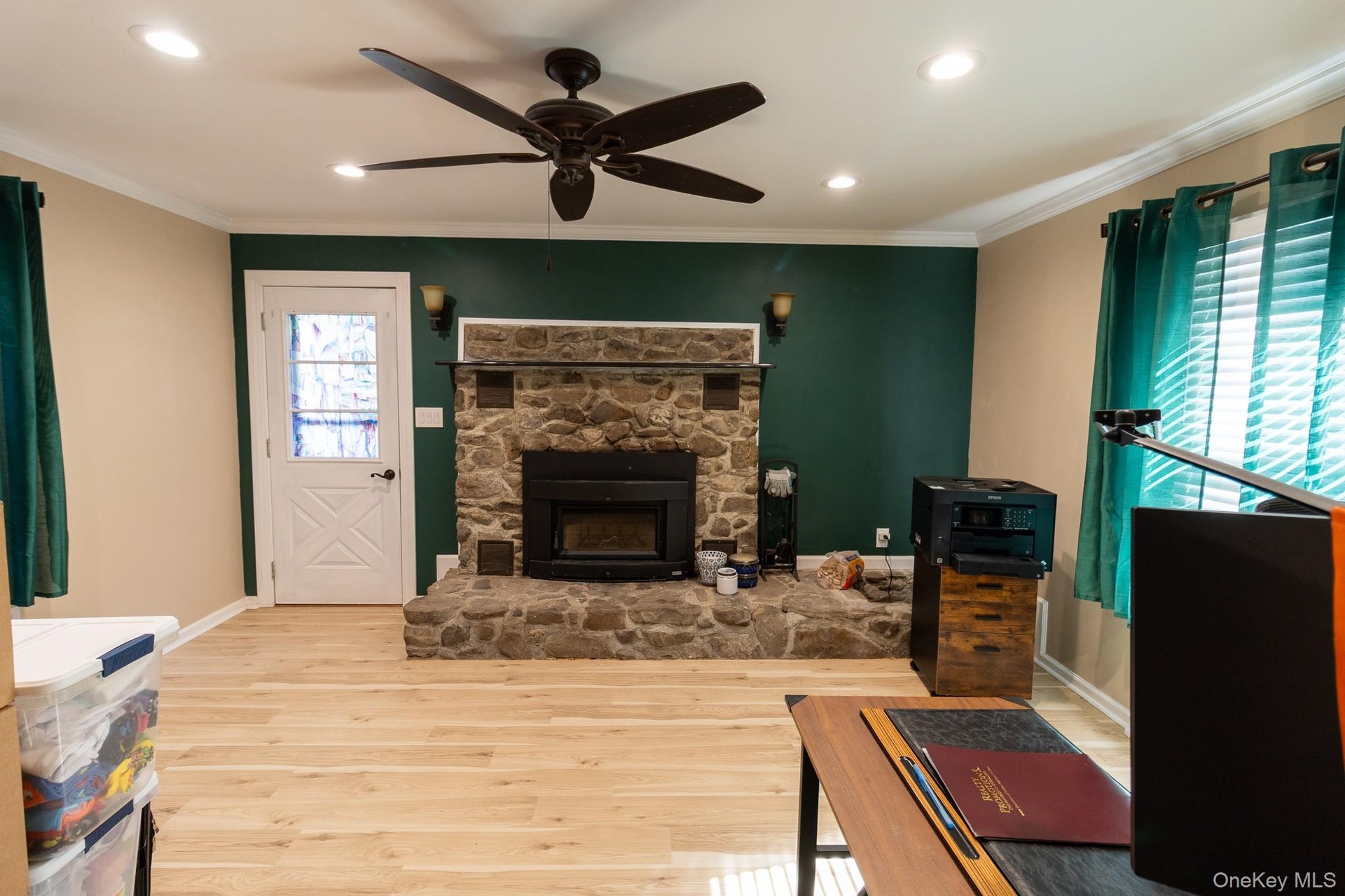 This living area has a beautiful stone fireplace as a focal point for gatherings and every day comfort.