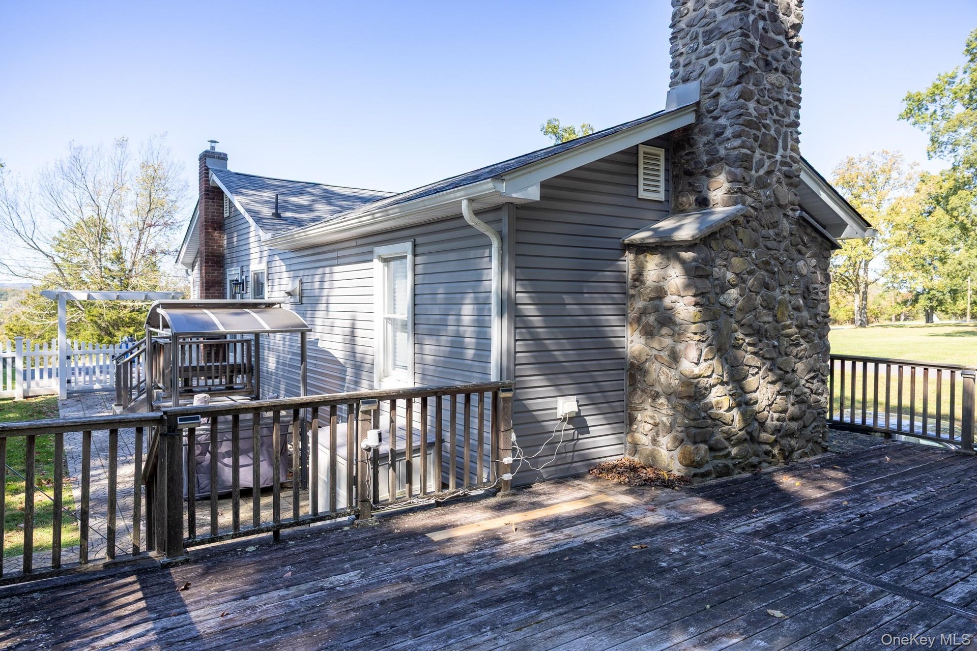 Elevated outdoor deck offering space to enjoy the surrounding natural setting.