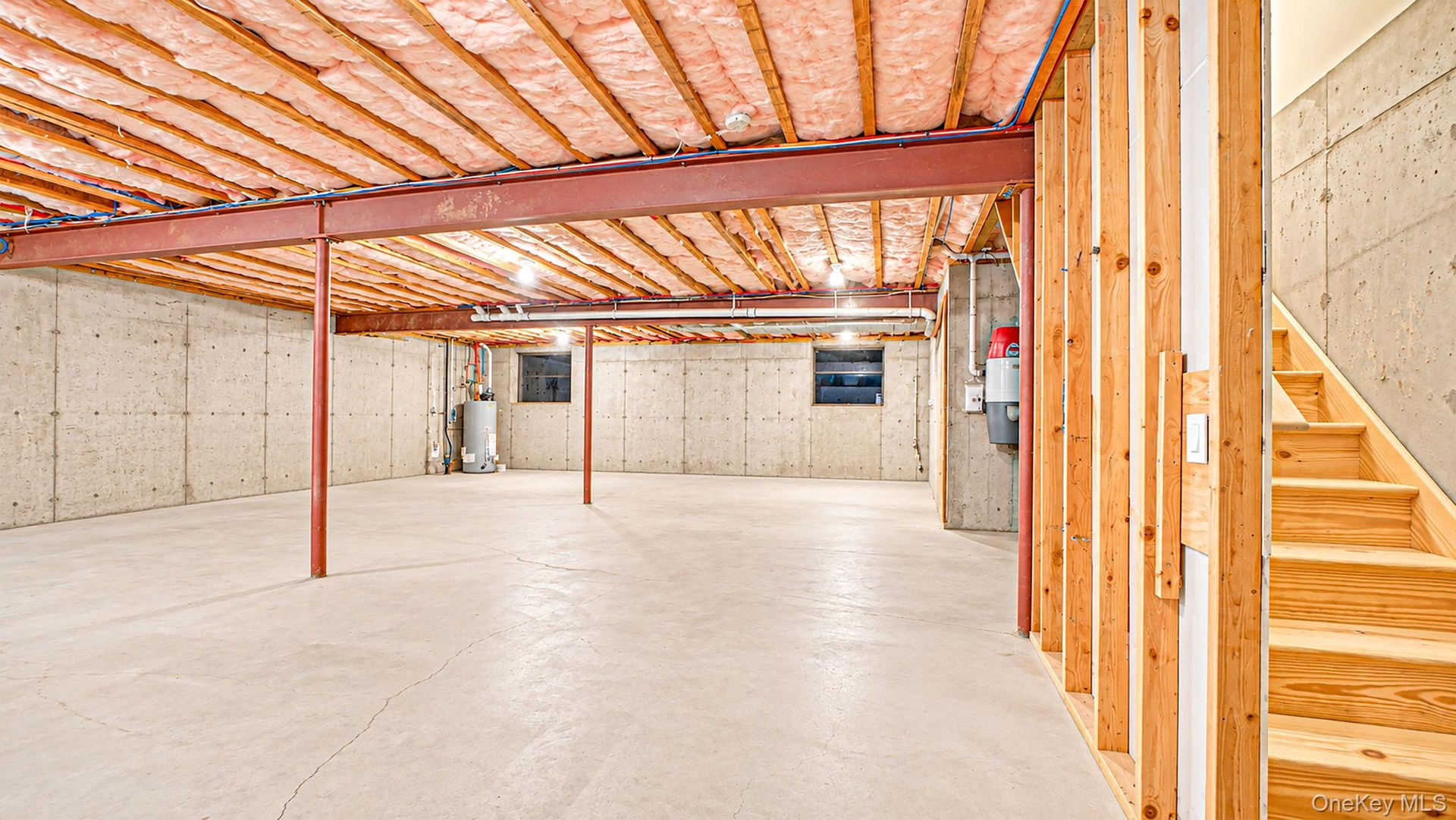 Expansive unfinished basement featuring exterior entrance, utilities and crawl space