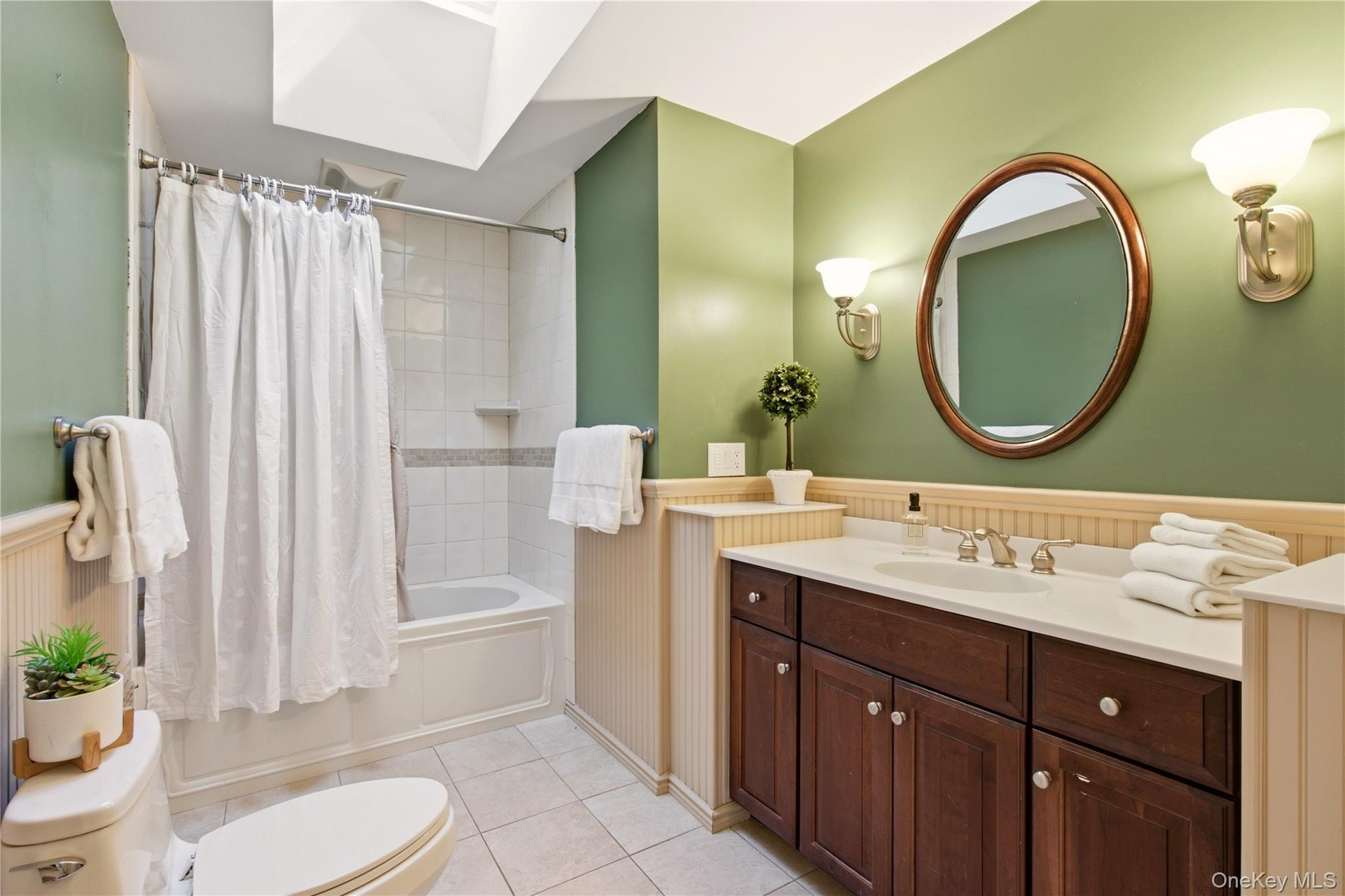 spacious family bathroom with tub/shower