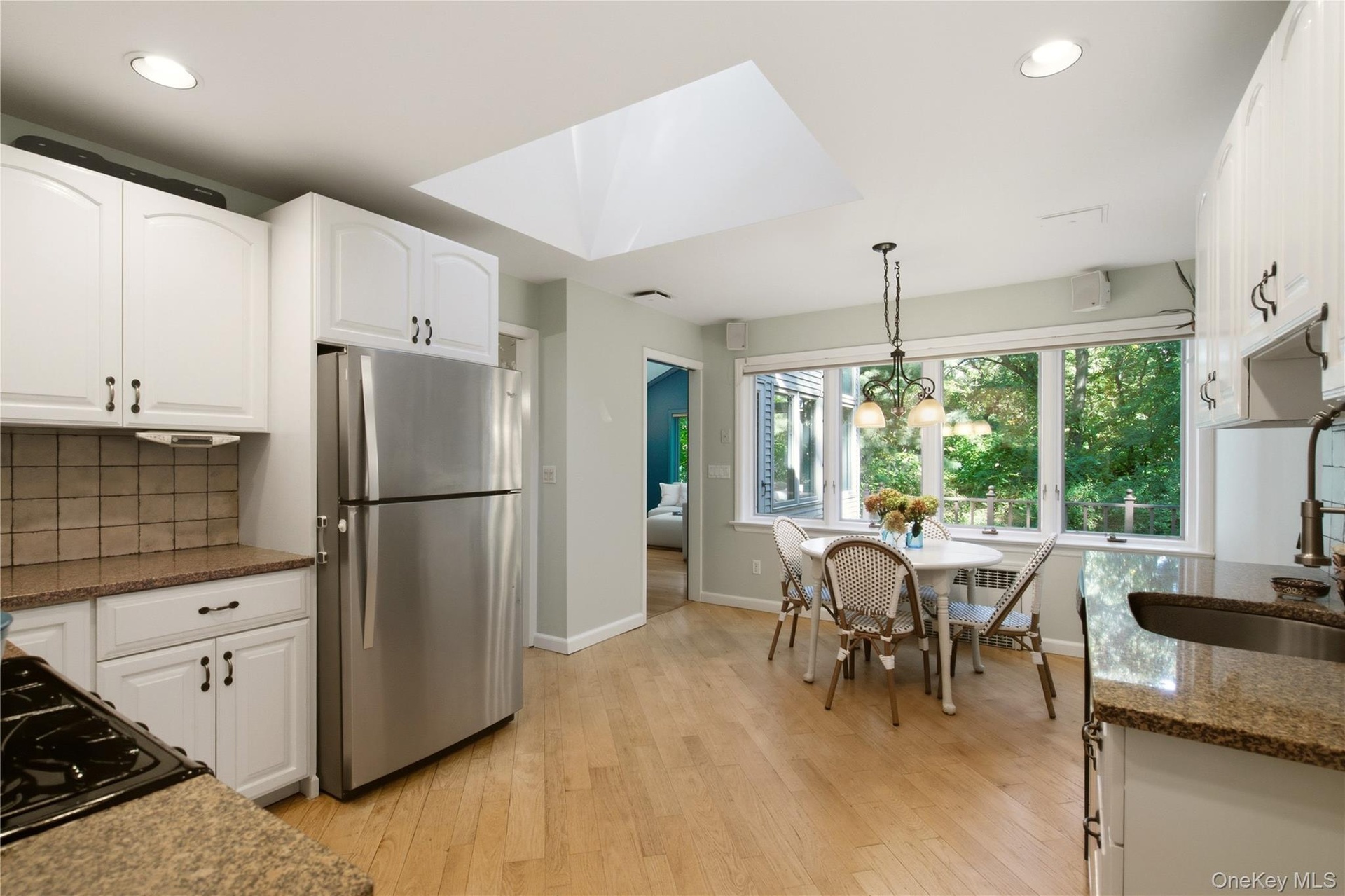 kitchen leads to dining room and family room