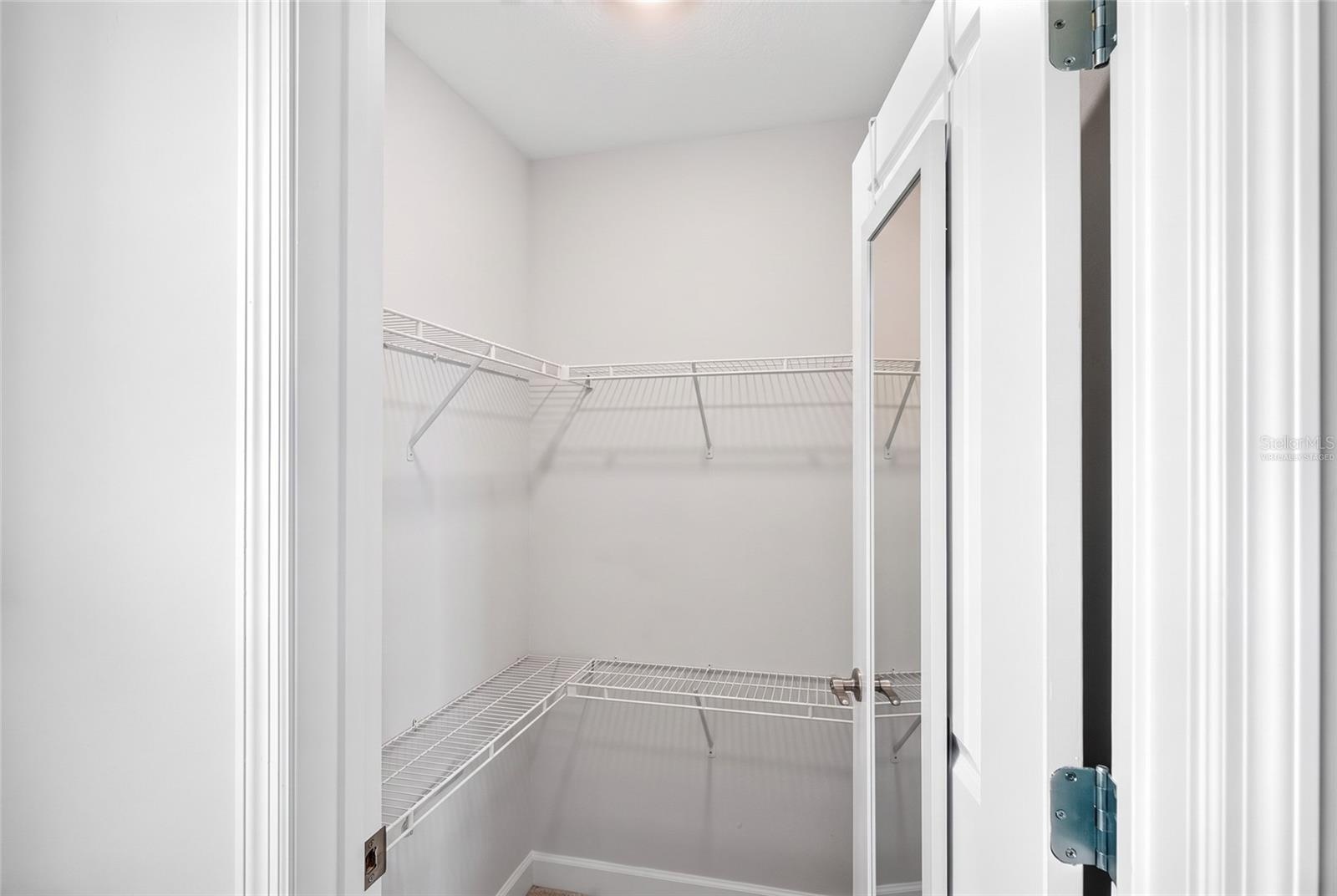 Upstairs 2nd bedroom closet virtually staged
