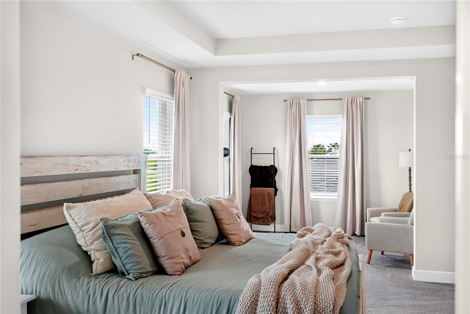 Primary bed facing sitting area