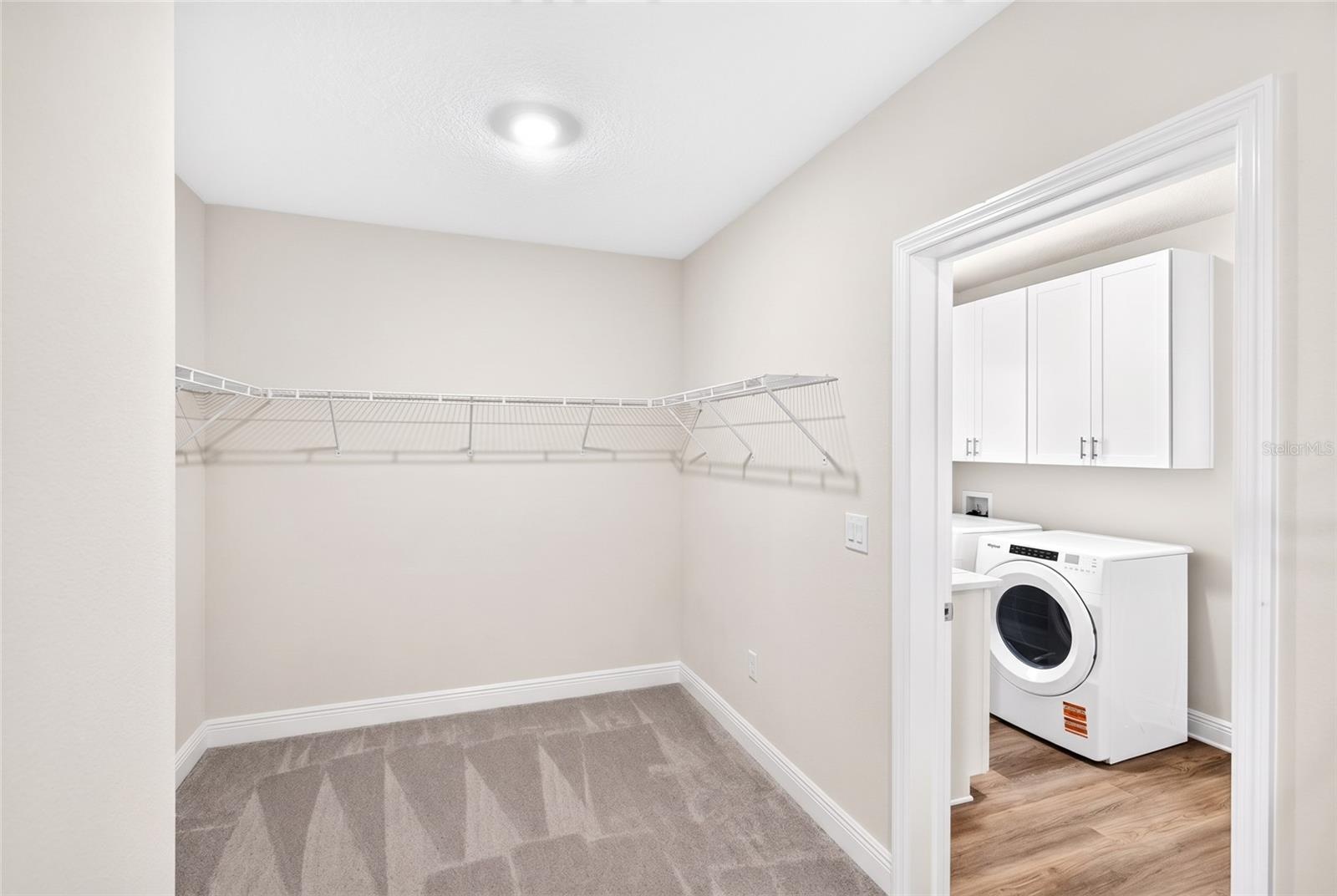 Primary closet virtaully staged