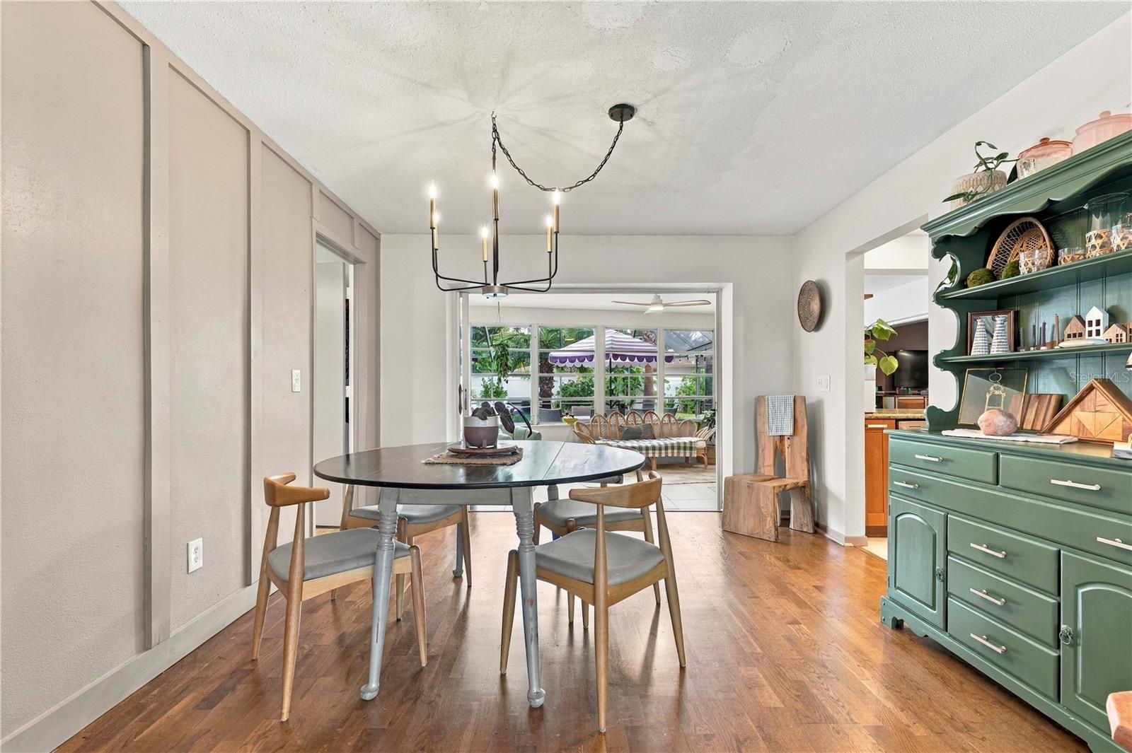 Dining room leading to Sun room, kitchen and primary bedroom suite