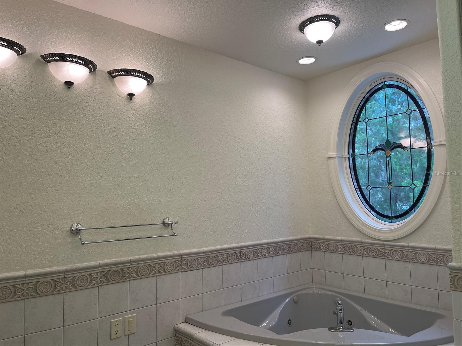 Jet tub - Anderson ovall stain glass window