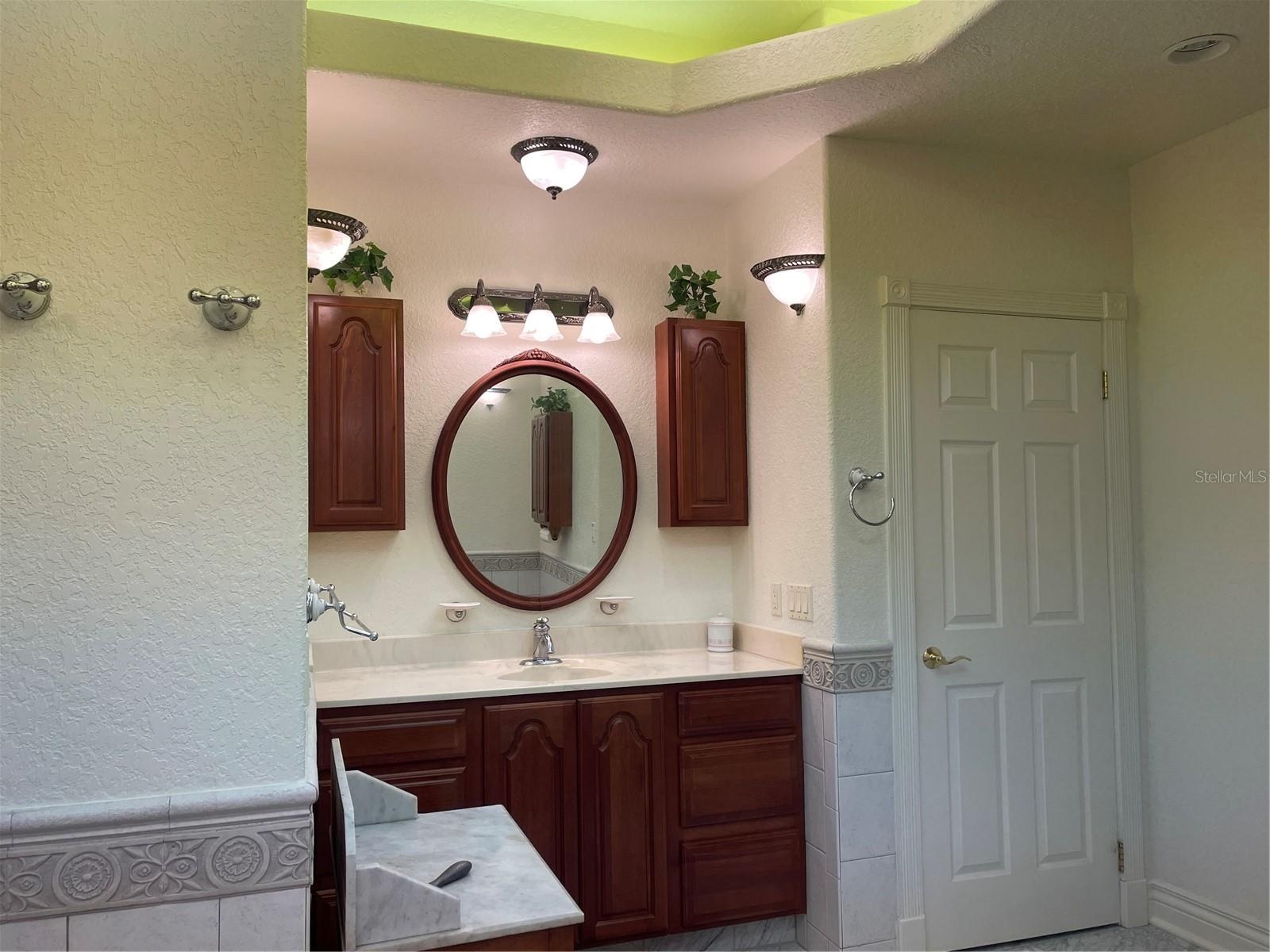 Linen closet to the right of vanity.