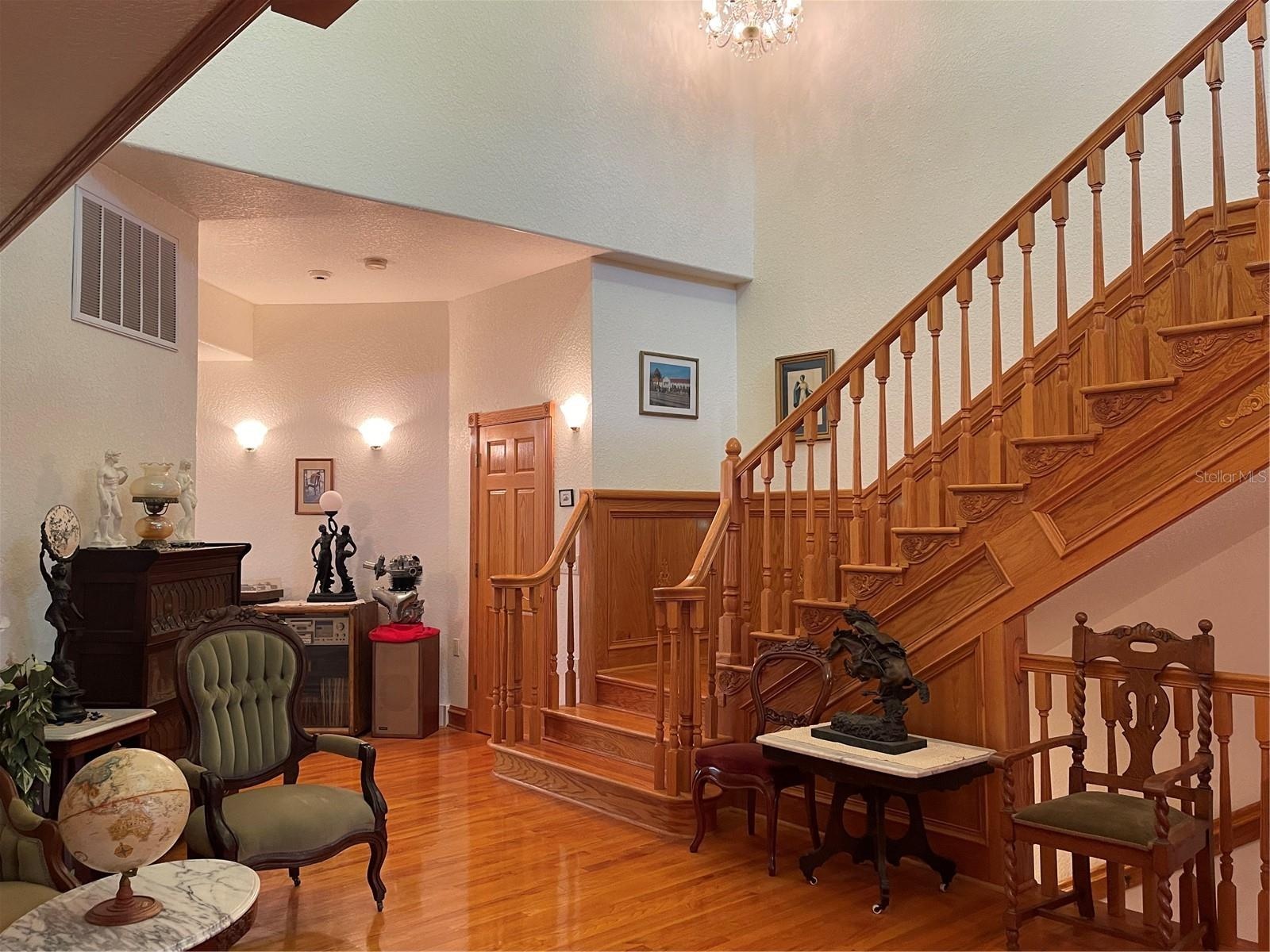 To the left of the storage closet is the living room, kitchen and primary bedroom