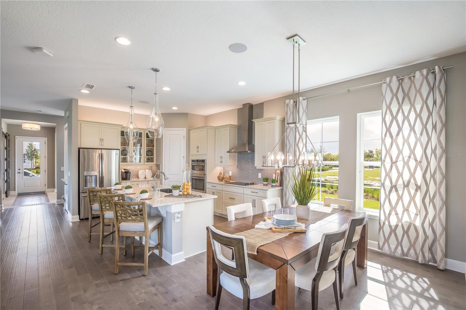 The sample photos included are of the model home and are meant to showcase the craftsmanship and design quality.