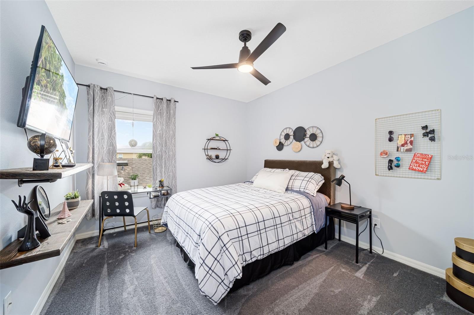 Comfortable third bedroom with built-in closet storage.