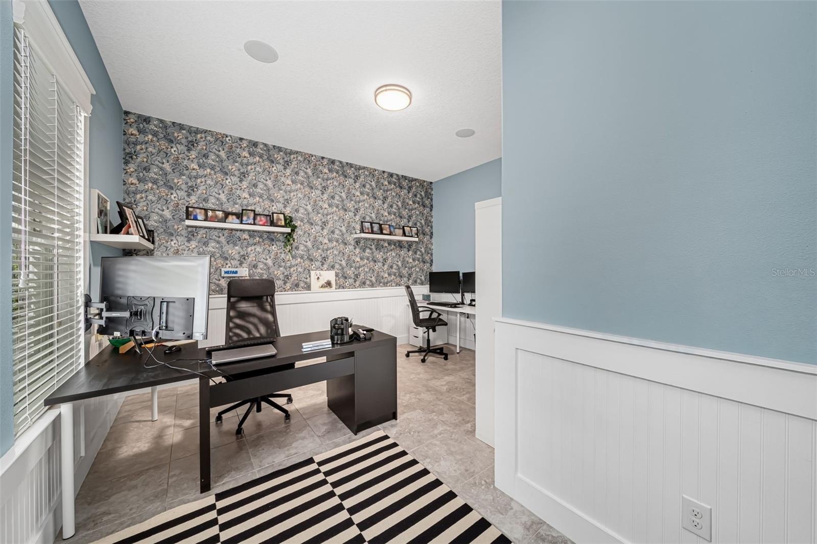 Multi-functional space ideal for a home office, study, or bonus room.