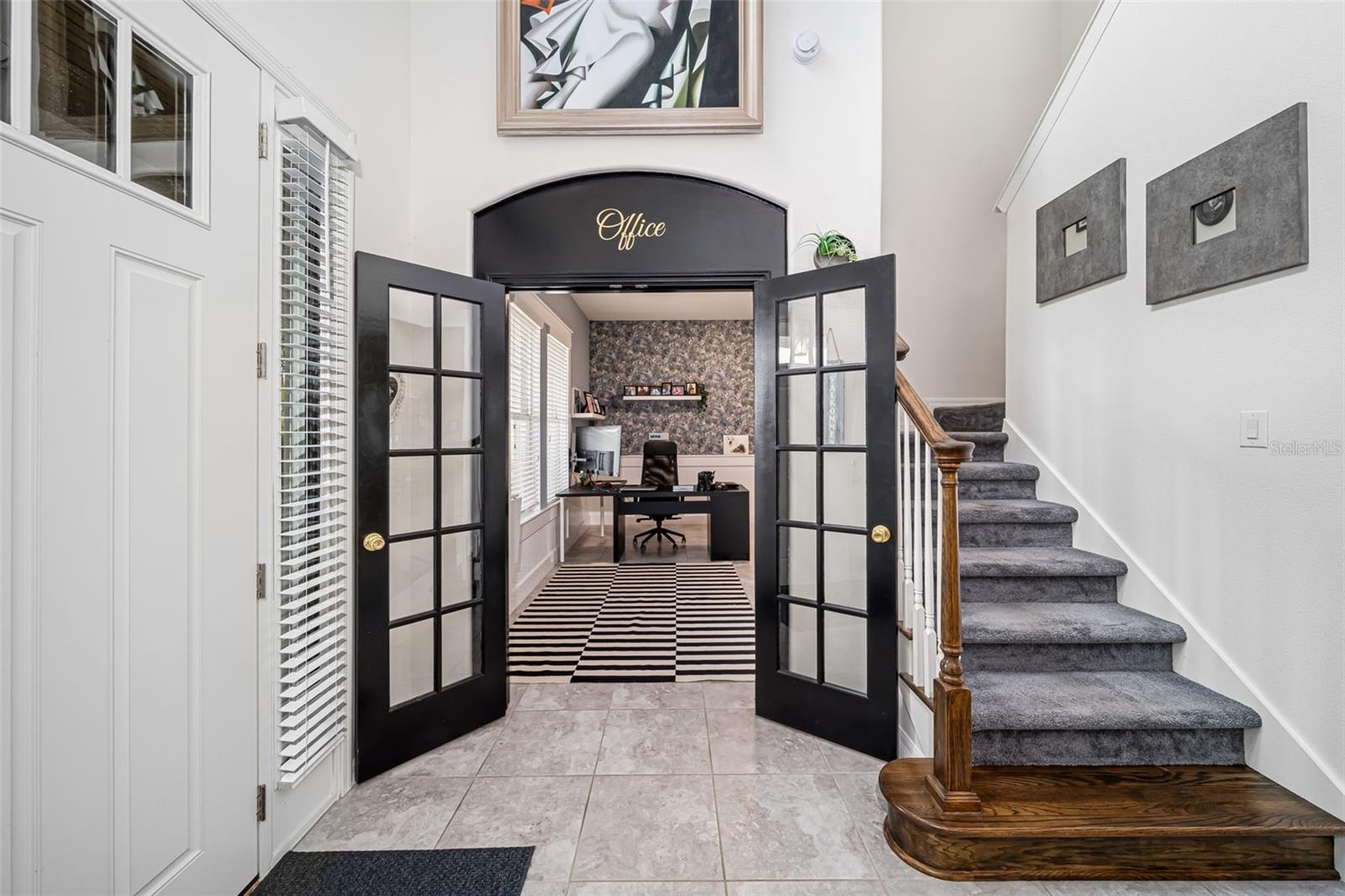 Versatile room offering the flexibility to serve as a home office or bonus space.
