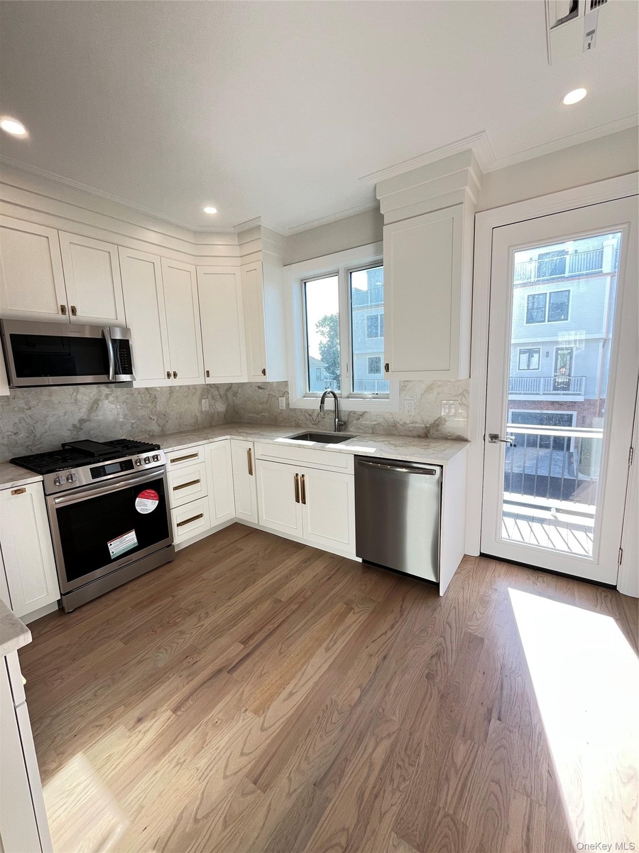 Deck off the kitchen offers the perfect setting for al fresco dining or entertaining.