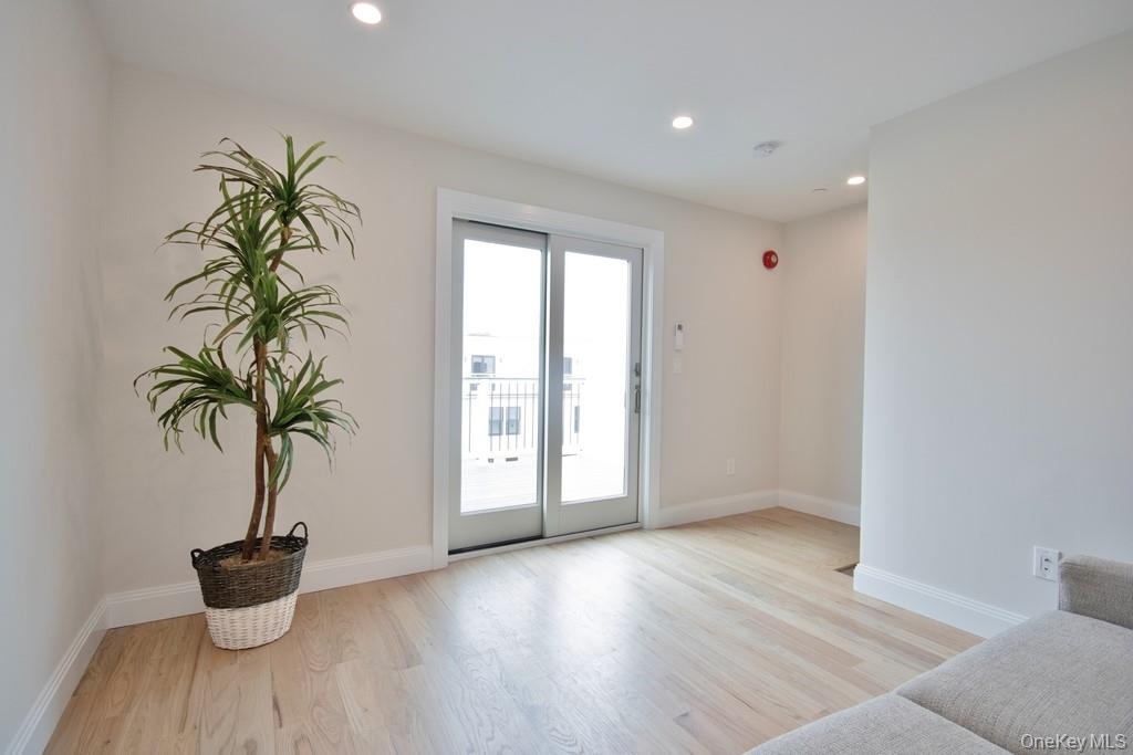 Recreation room with slider door out to deck.