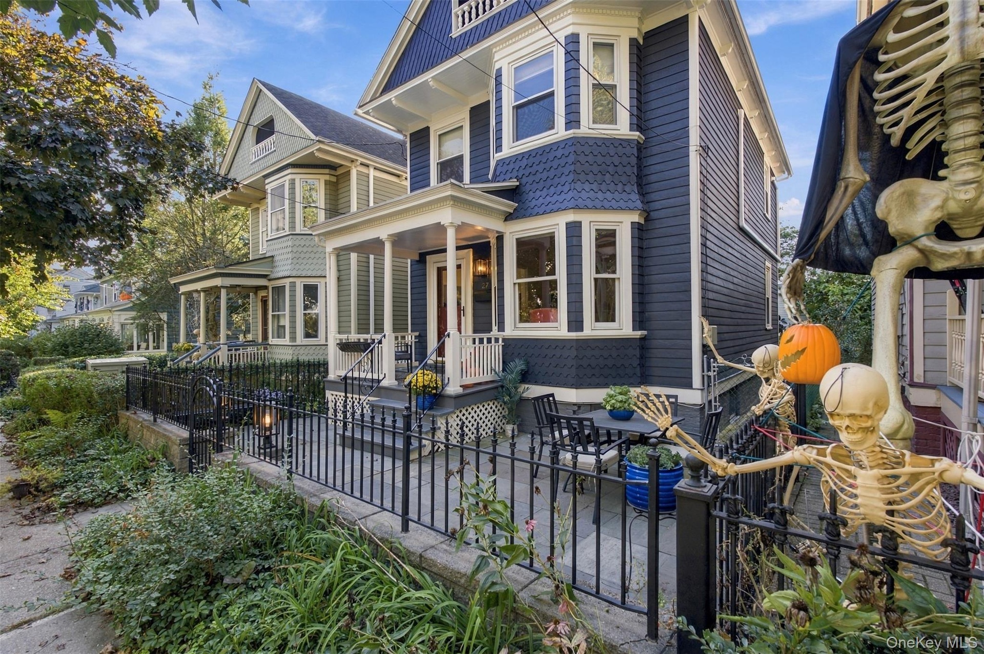 Blue clapboard siding with fish scale shingle accents
