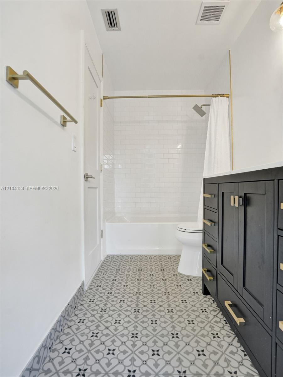 Custom Tiles in the cabana Bath & Subway tiles around the tub!