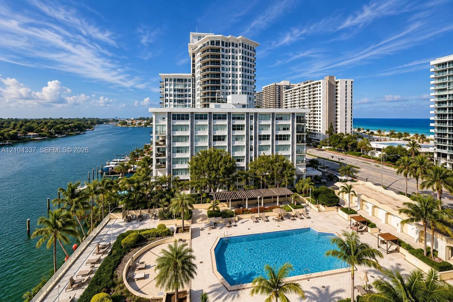 View from the private terrace, capturing Indian Creek to the west, the building’s resort-style pool below, and the Atlantic Ocean to the east.