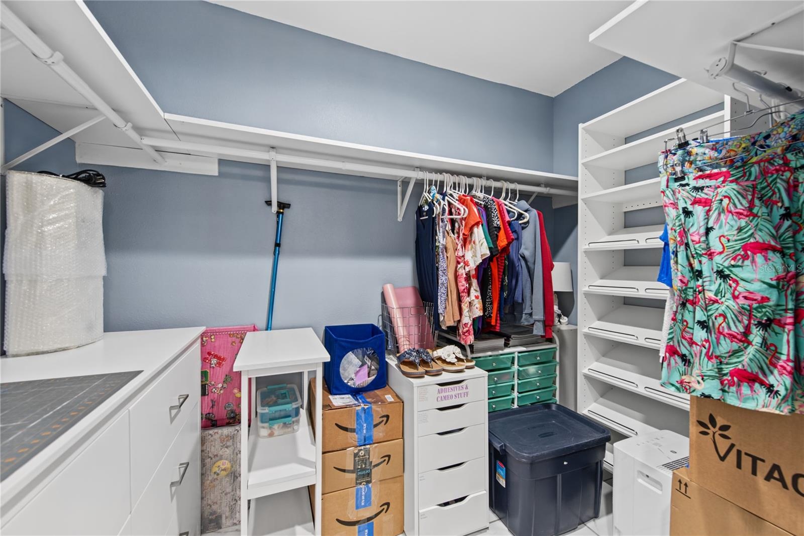 PRIMARY BATHROOM WALK-IN CLOSET, ONE OF TWO