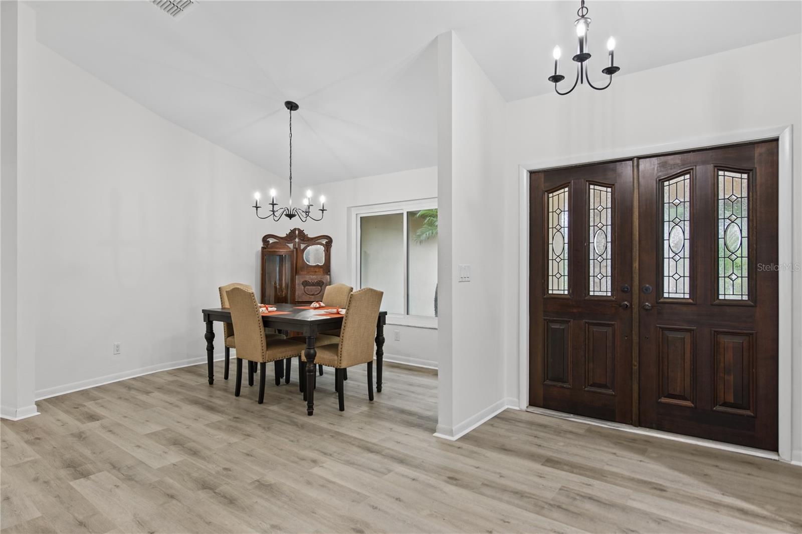 FRONT ENTRANCE DOUBLE DOORS & FORMAL DINING ROOM