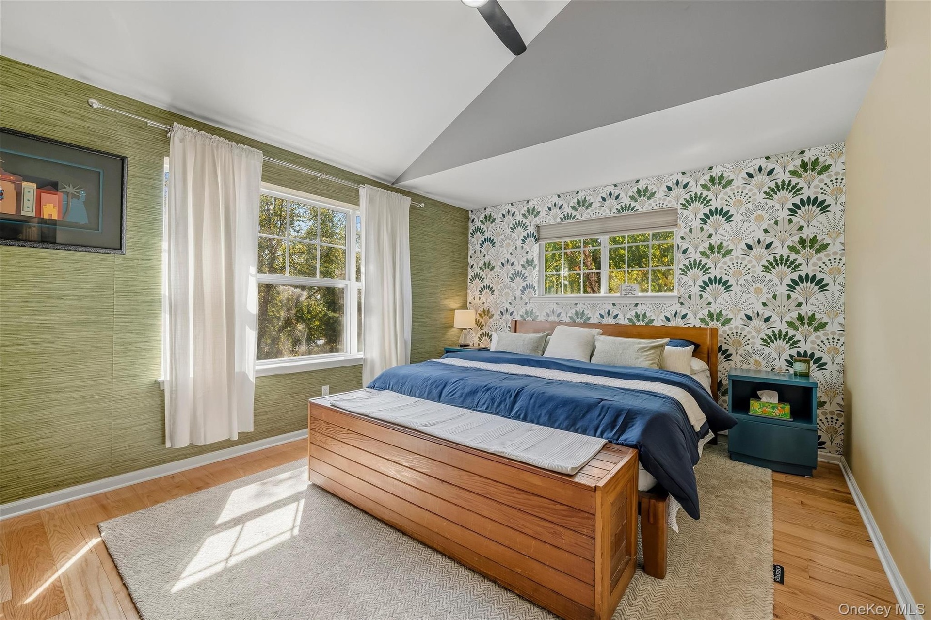 The primary suite has high angled ceilings.