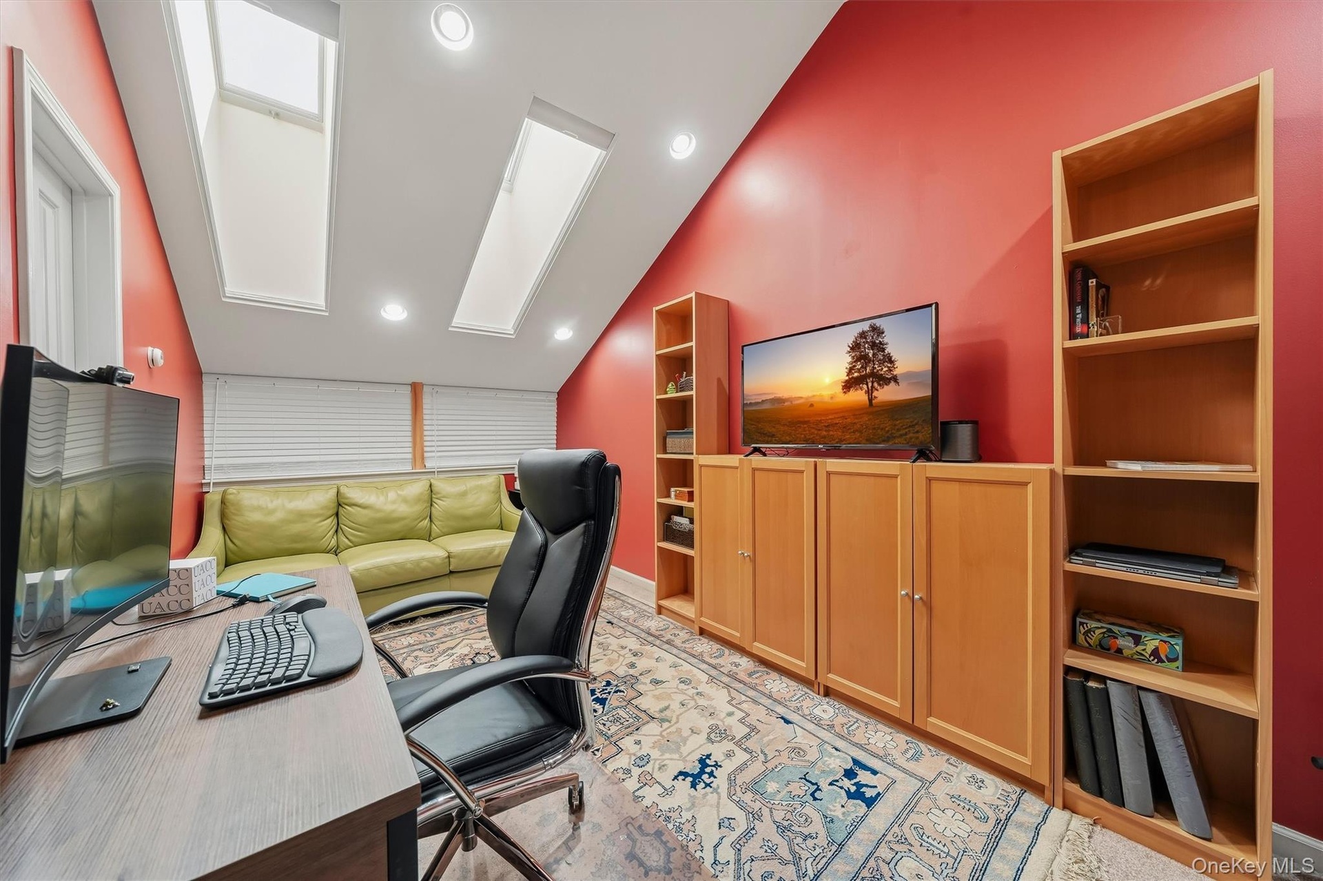 The third floor loft space with skylights serves as the perfect home office. On both sides are two huge walk in storage rooms.