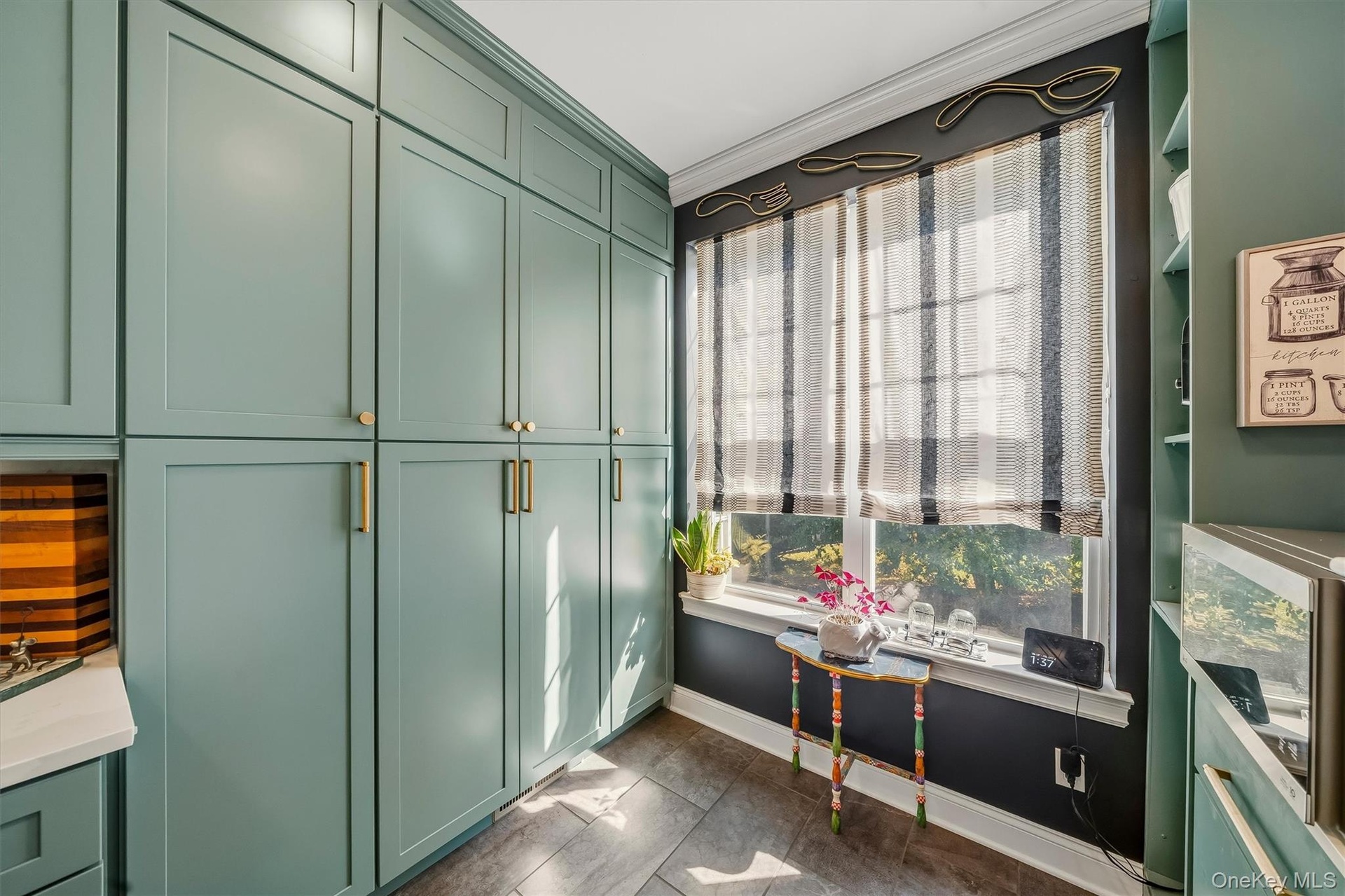 The cabinets are floor to ceiling!  There is more space in this kitchen than most single family homes.