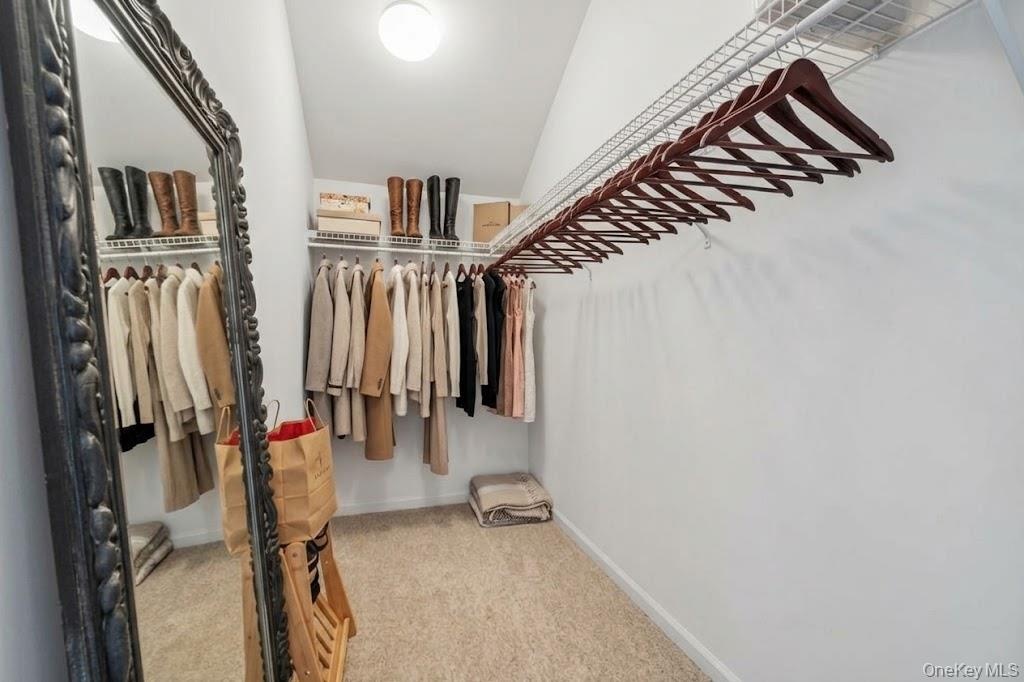 A deep walk in closet in the guest bedroom is just one of the luxurys this home has.