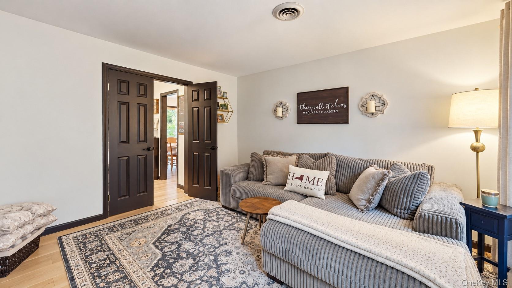 Light wood-finish flooring extending into an adjacent space