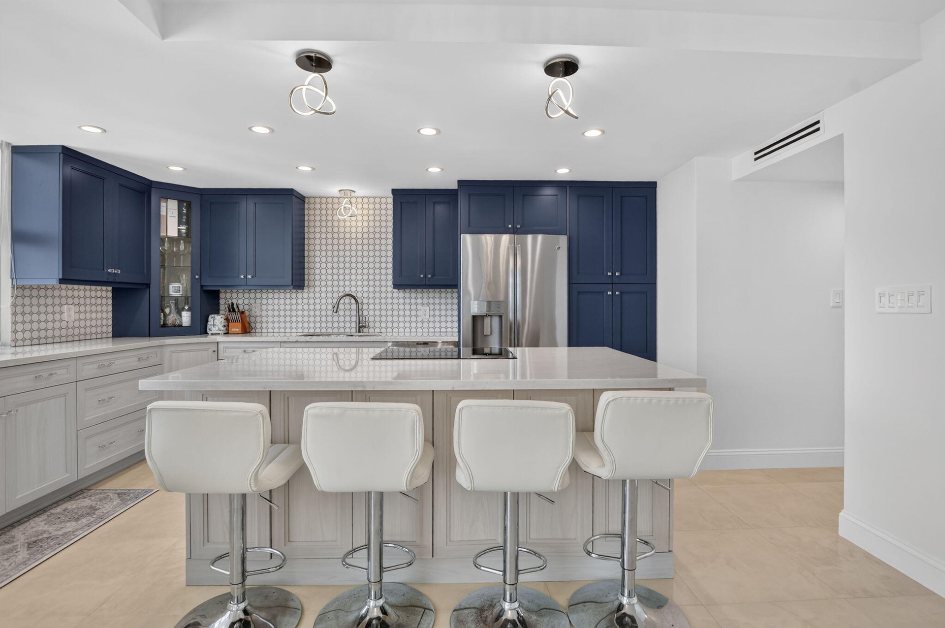 Island, soft close cabinets, pantry, decorator fixtures and endless views.