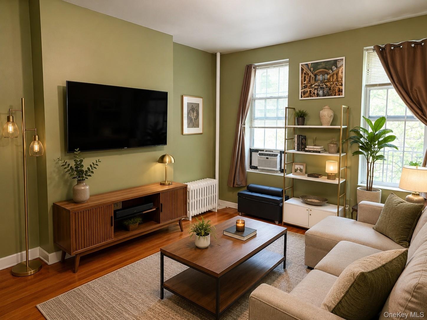 Hardwood-style flooring throughout this living space (virtually staged)
