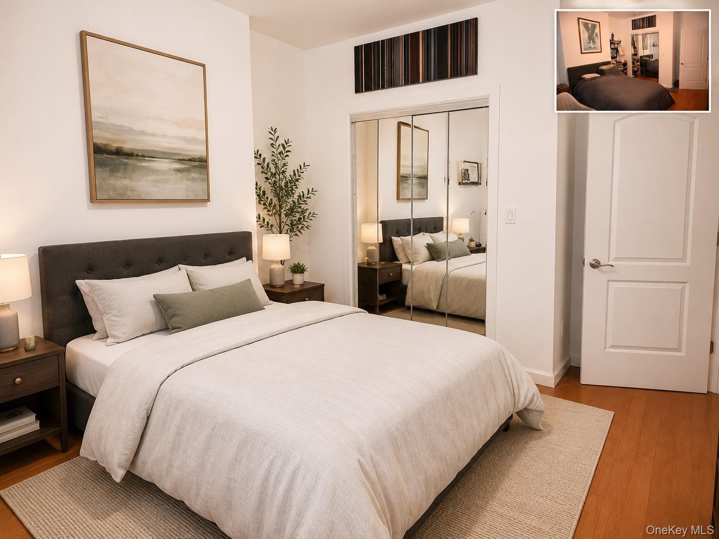 Bedroom featuring wood-finish flooring and a neutral color palette(virtually staged)