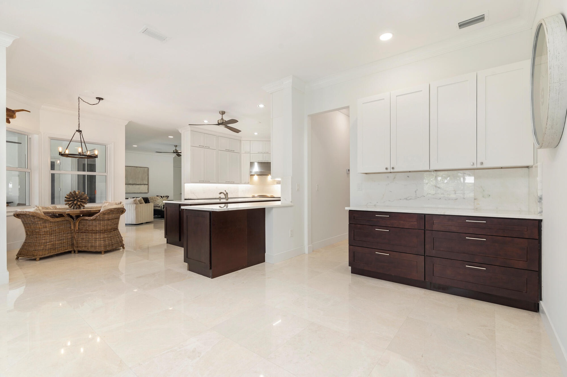 Spacious kitchen and dining area, extended area for a coffee bar or serving area with an abundance of cabinets, recessed lighting, and a kitchen islan