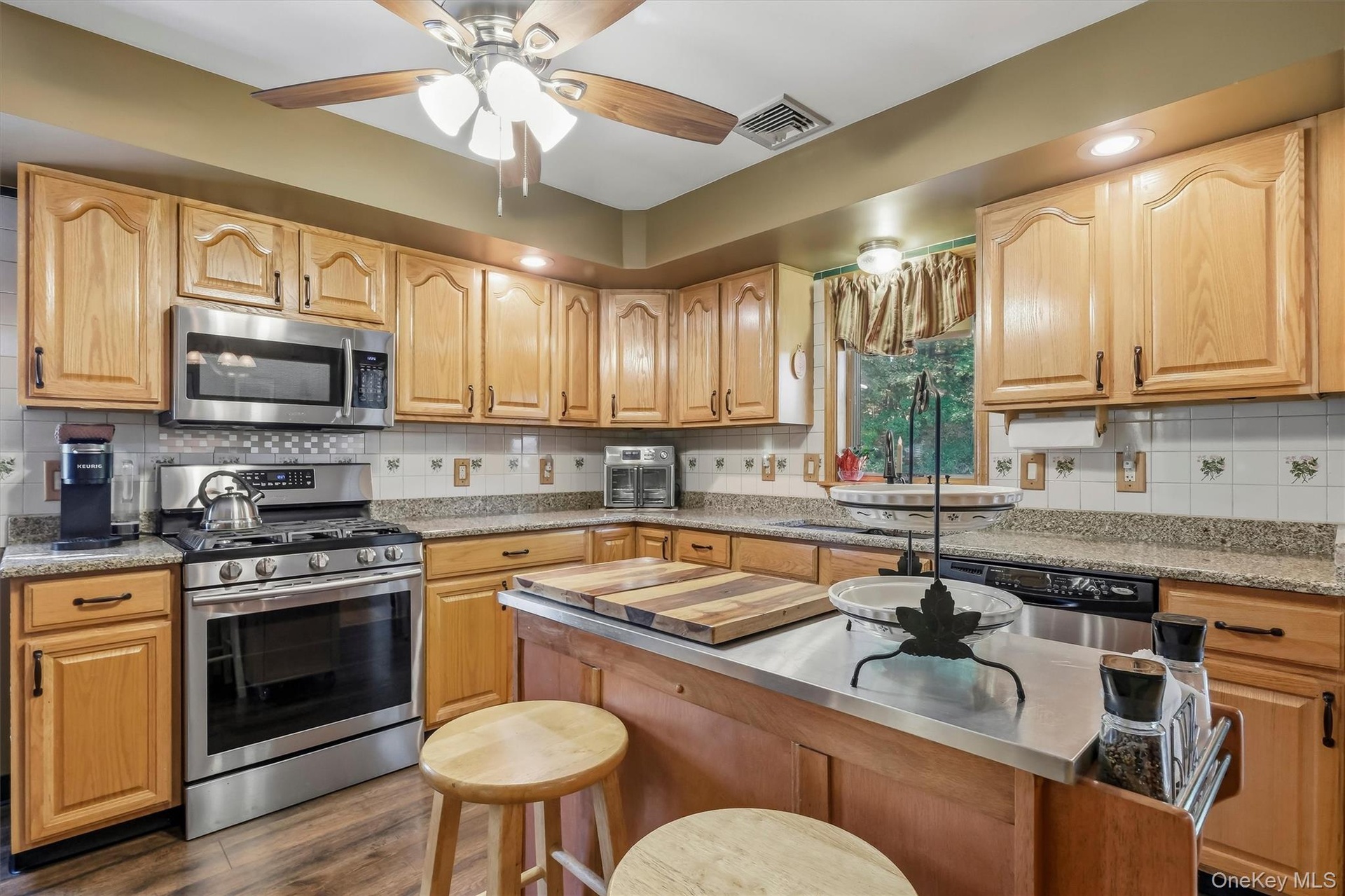 The kitchen was updated with granite counters, LVP floors and a deep farmhouse sink.