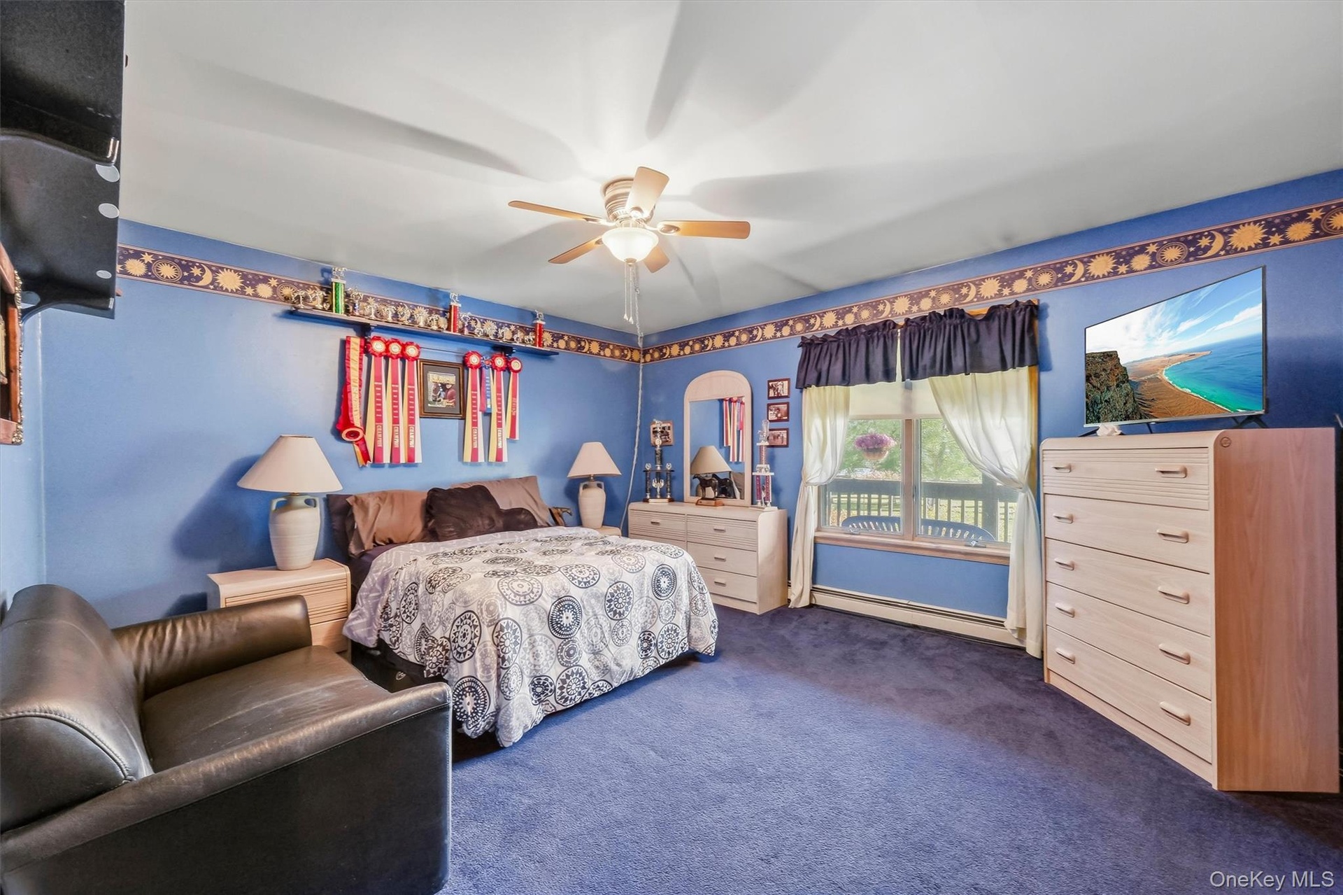 First floor bedroom features a double window, center ceiling fan and generous closet space.