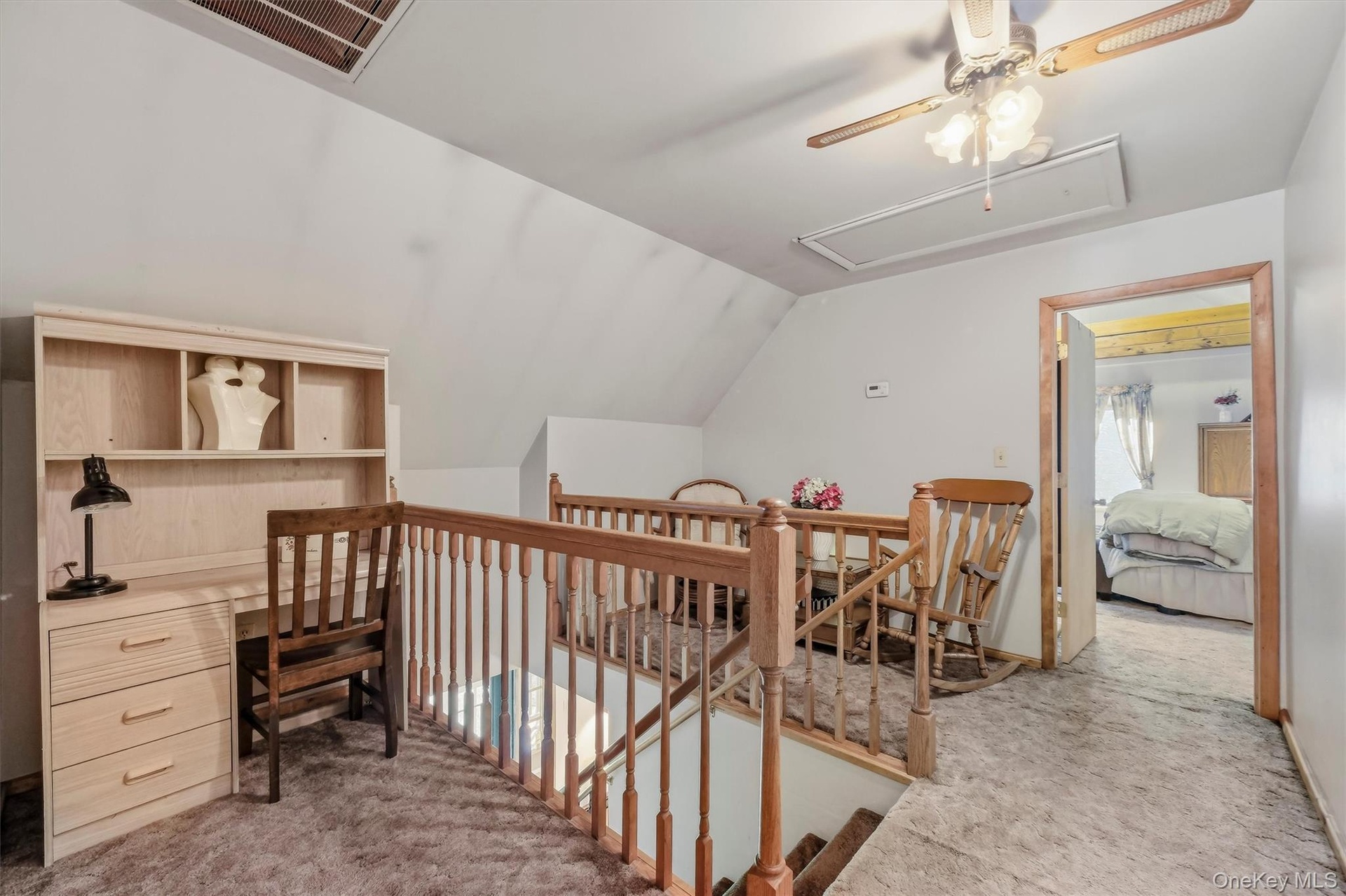 The landing on the second floor, with center ceiling fan, has areas that could be used as a reading nook, homework area or play area!