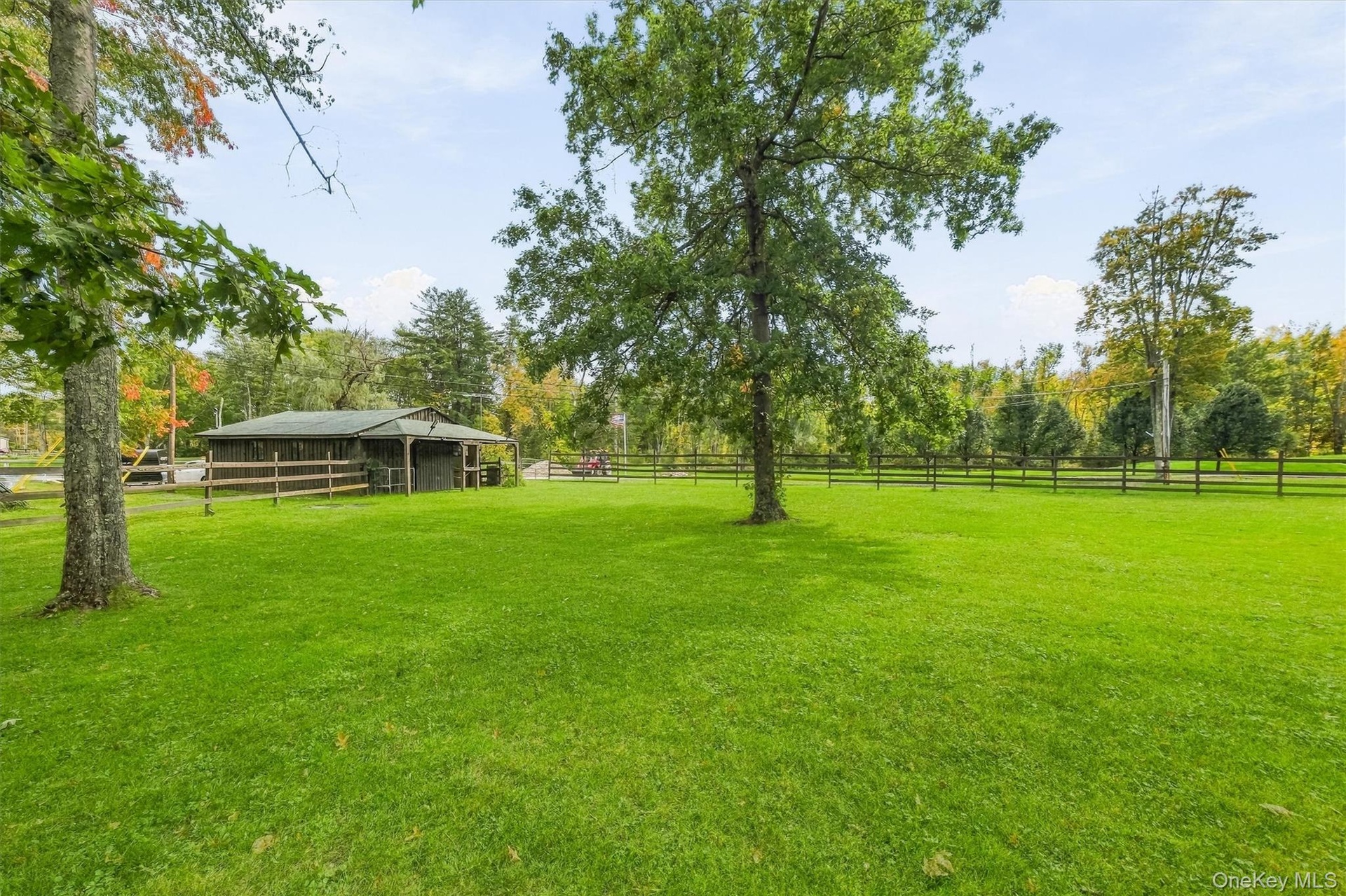 The barn has a large attached paddock with shelter, board fencing, shade trees and multiple gates.  Perfect for retirees or a herd of minis!  The barn