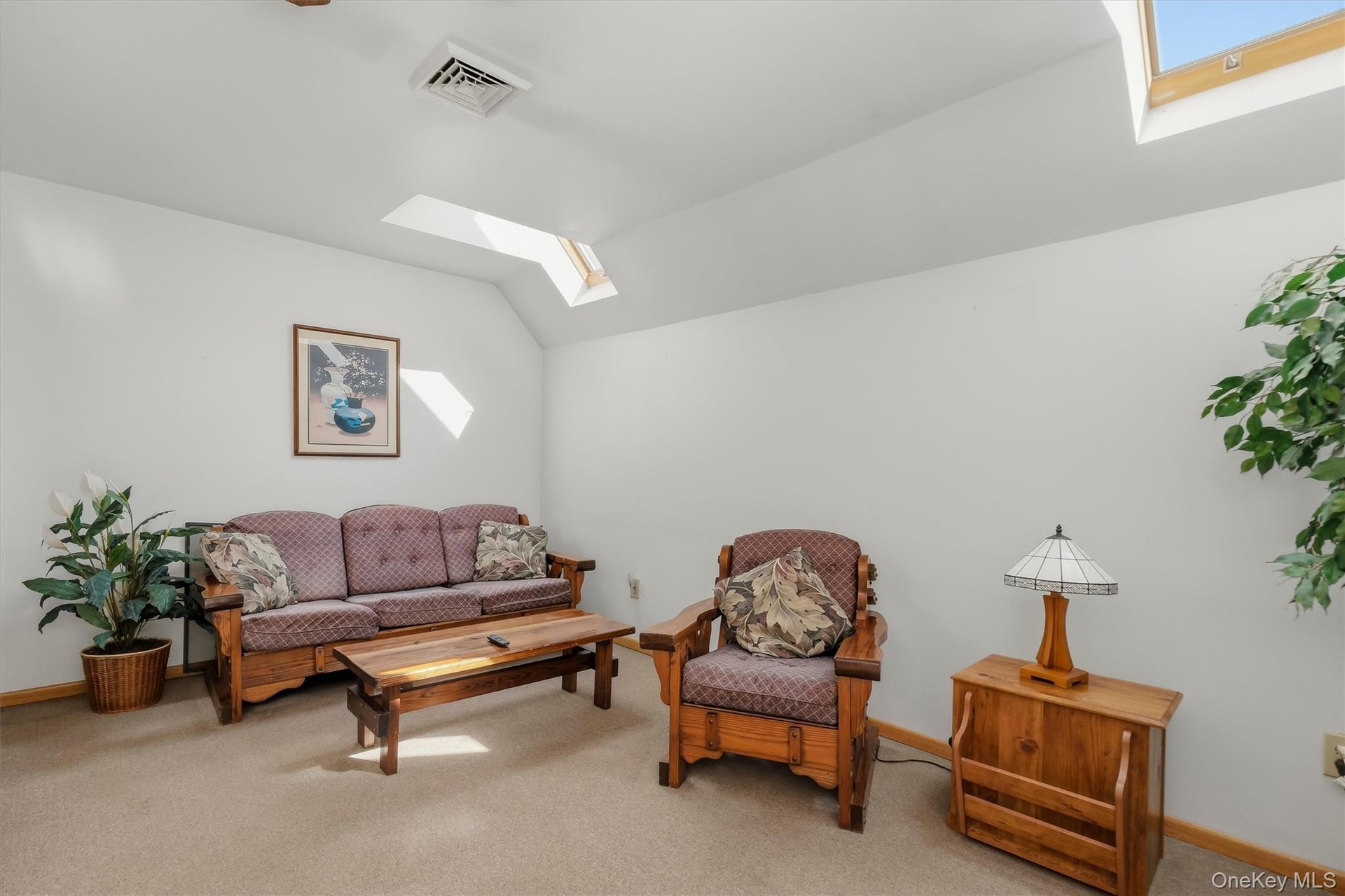 The finished space over the garage is quite comfortable with a tray ceiling, skylights and a full bathroom.  It would be great for an office, teen spa