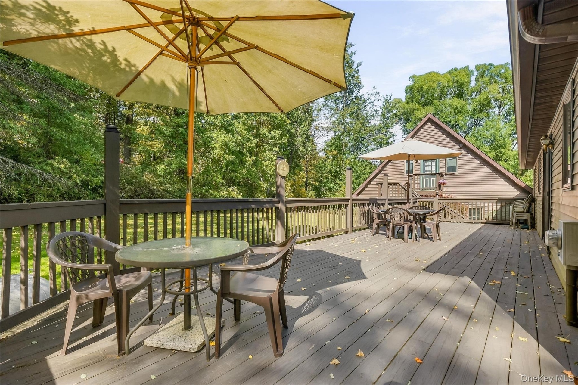 The spacious wraparound back deck is an inviting place to grill dinner and linger over dessert on long summer evenings.