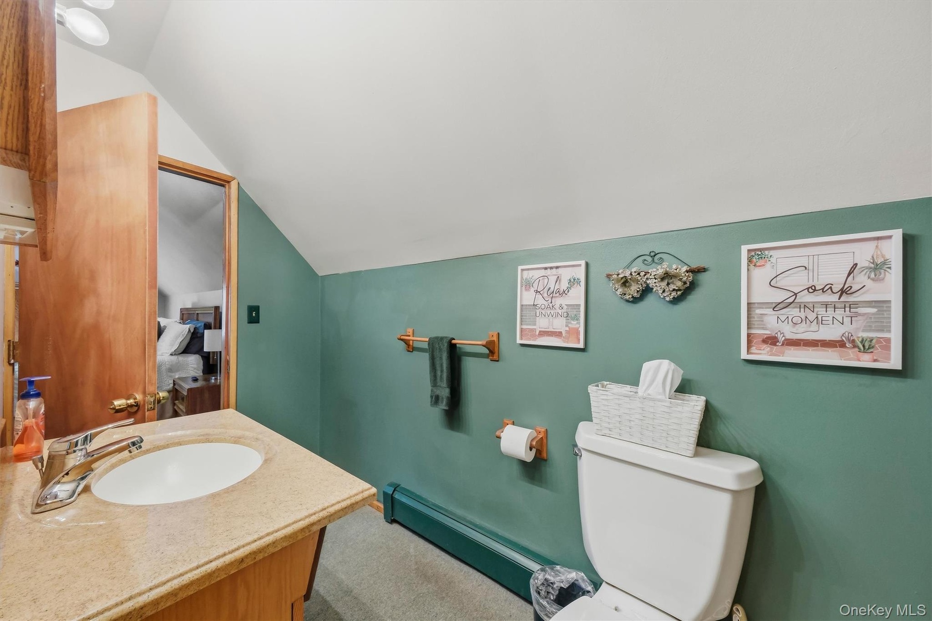 2nd floor full bathroom has entrances from the hallway and Primary bedroom.