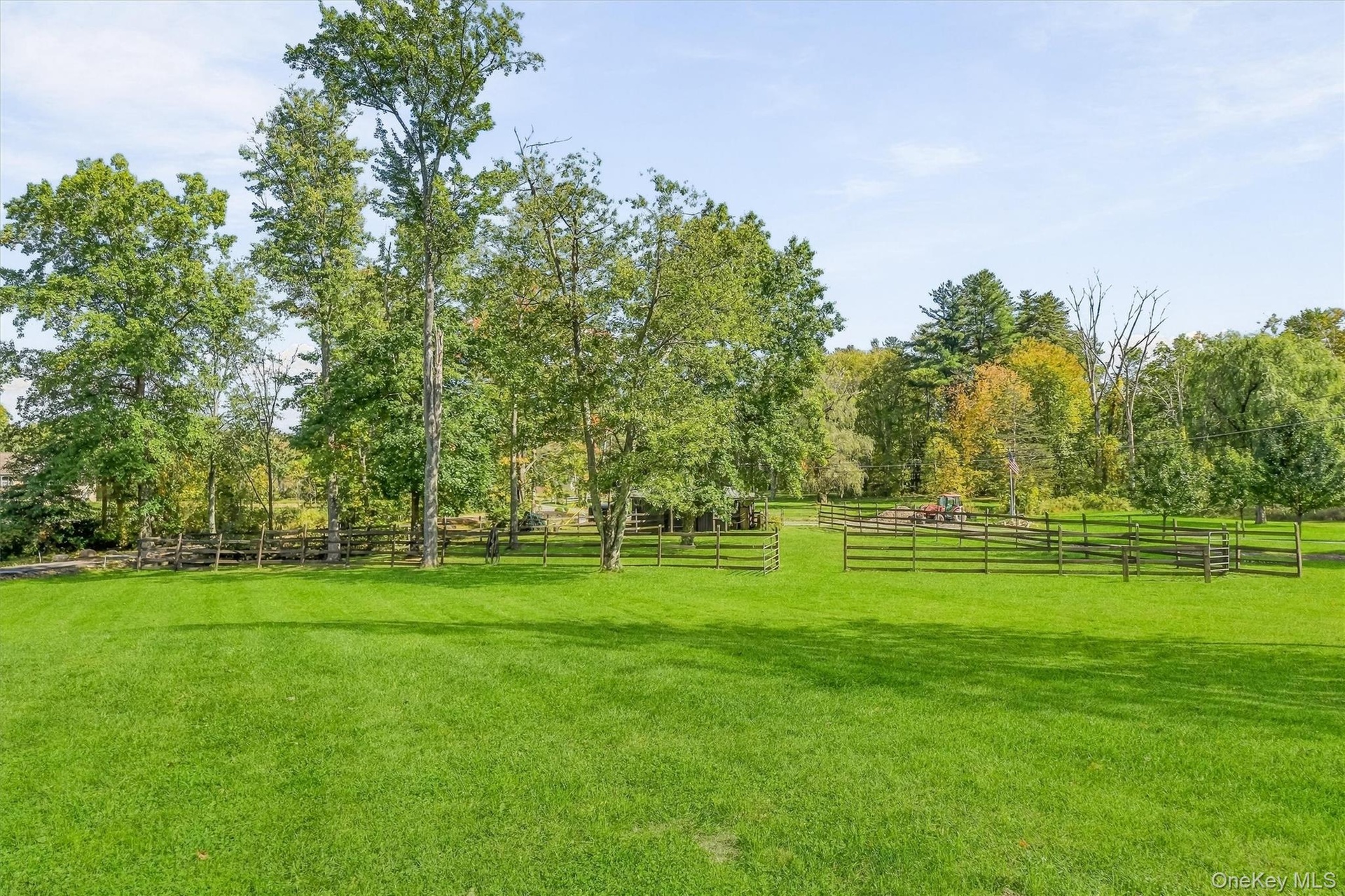 The view from the front yard towards the barn.  How special to have your horses out your front door, and be able to ride right to the Trail.