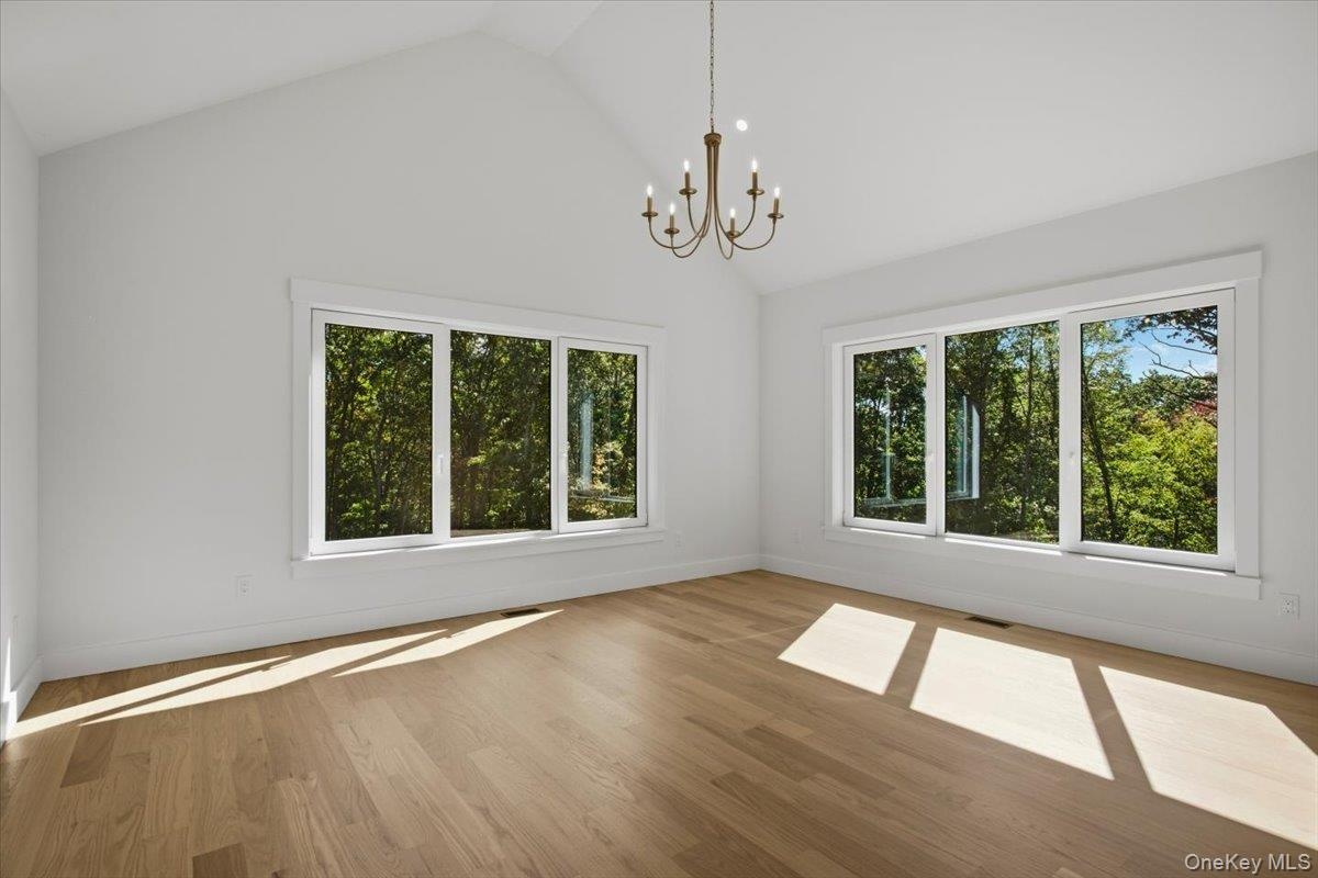Primary bedroom with 14ft ceilings