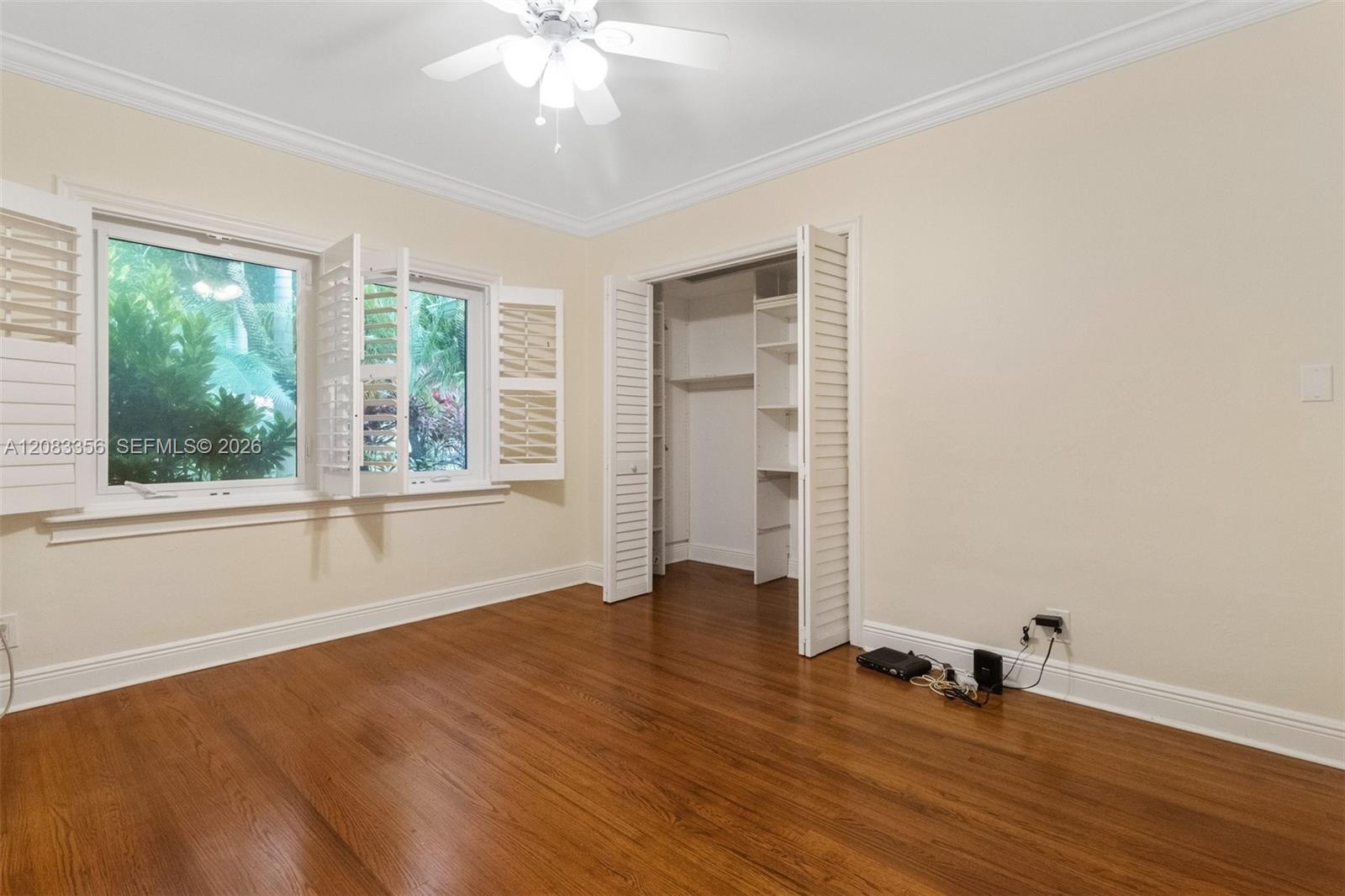 3rd Bedroom with Garden Views and Natural Wood Floors