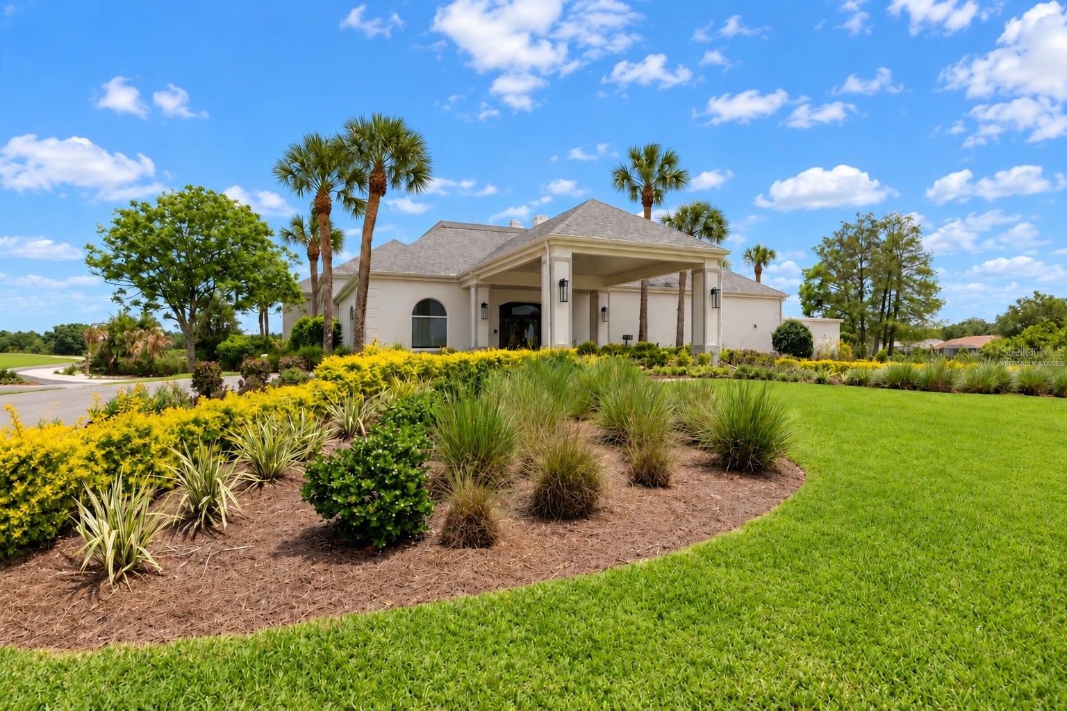 Clubhouse exterior, virtually staged, golf carts removed